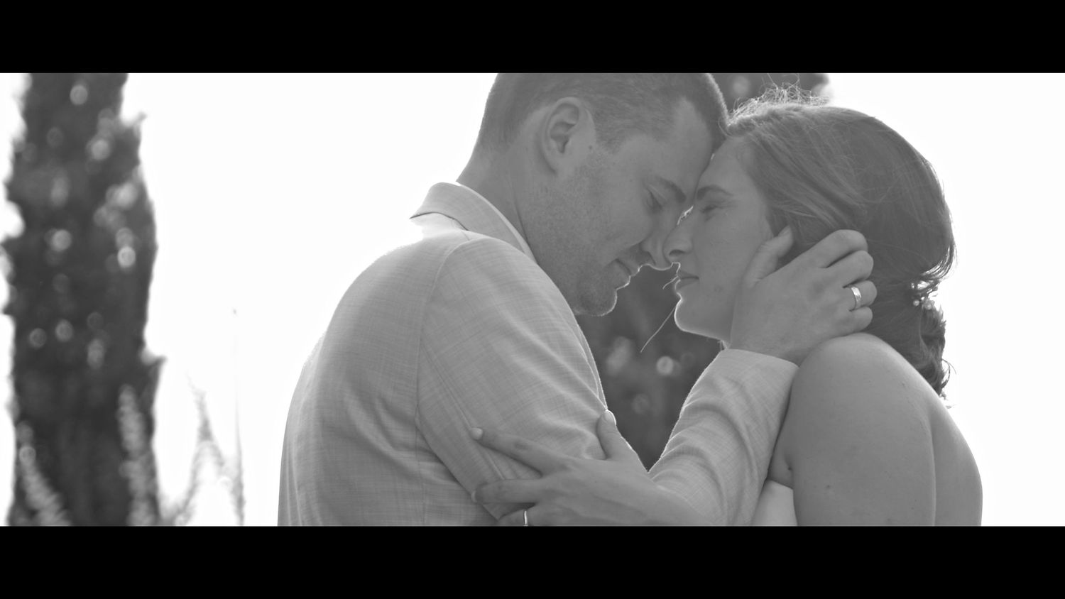 A romantic black and white moment between a couple on their wedding day.
