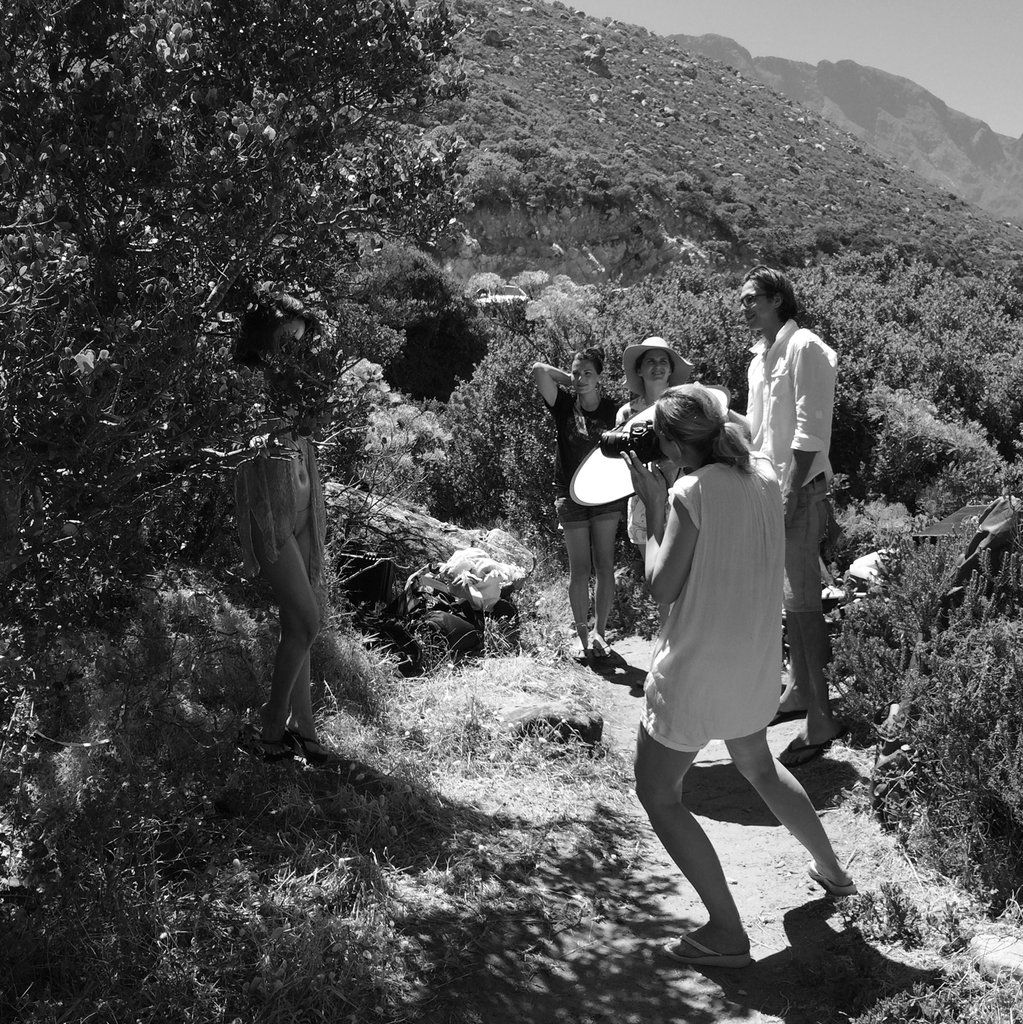 Black and white sequence showing a fashion photoshoot on a mountainous trail.