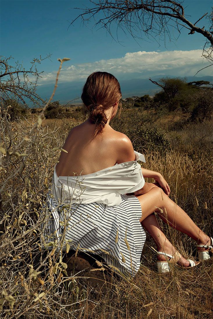 Striped dress photographed in natural desert setting with dry brush and bright sky.