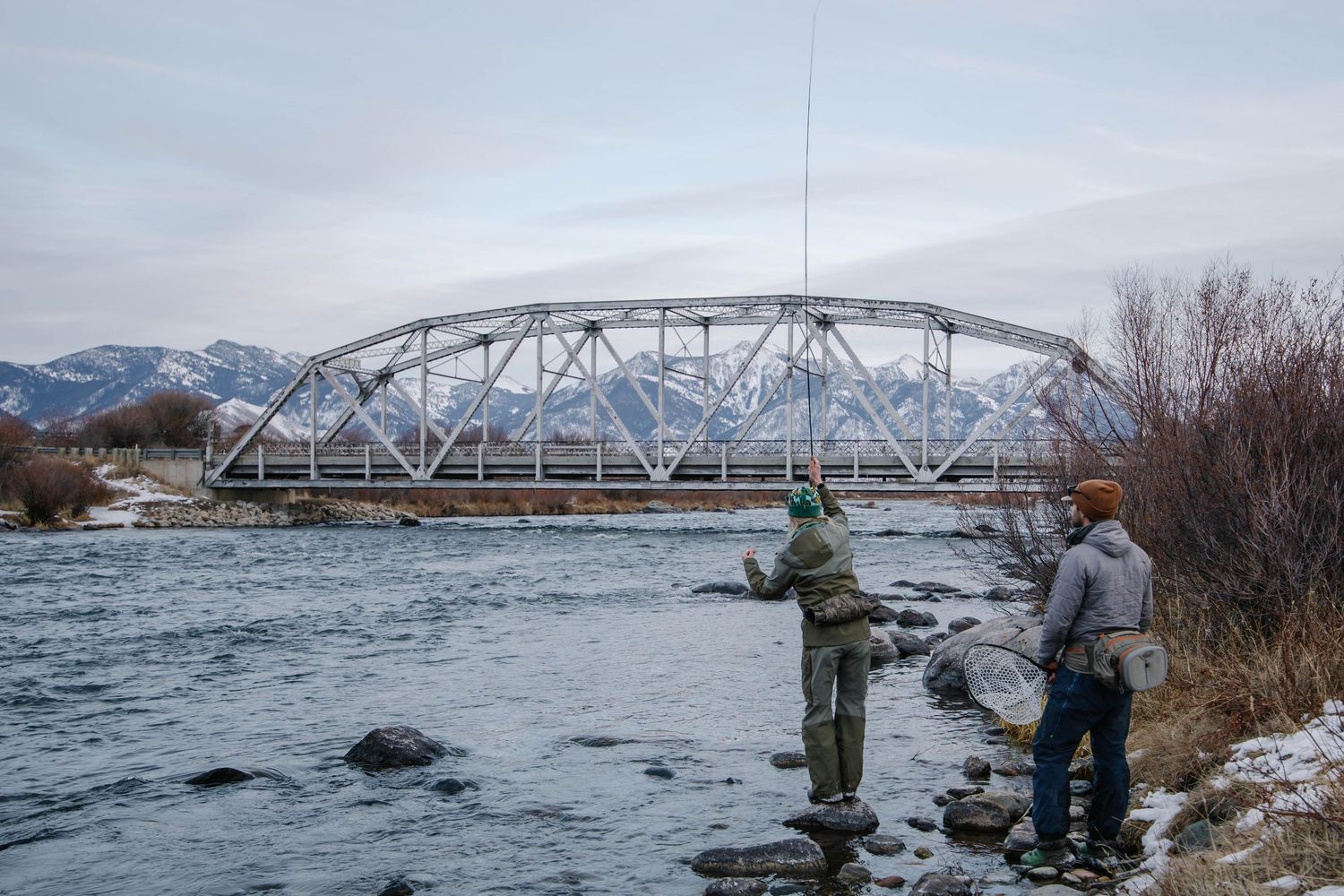 A couple fly fishing on the Madison River