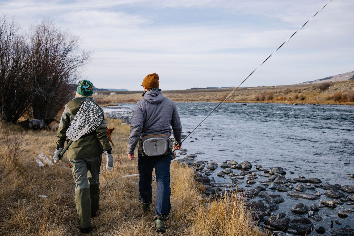 A couple fly fishing on the Madison River