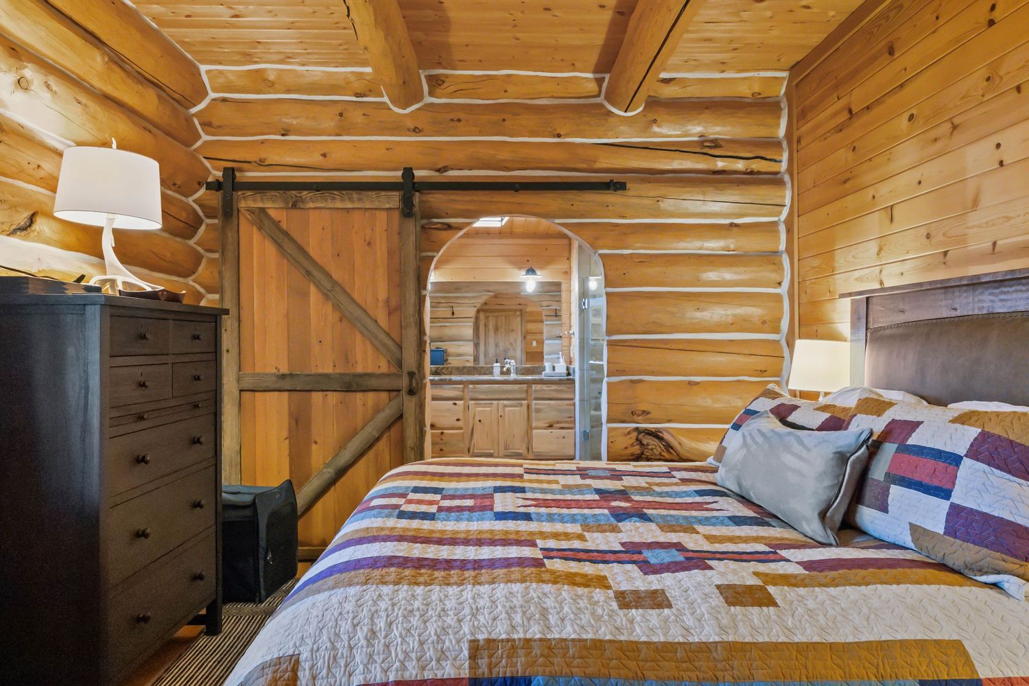 Primary bedroom in luxury Ennis, Montana home