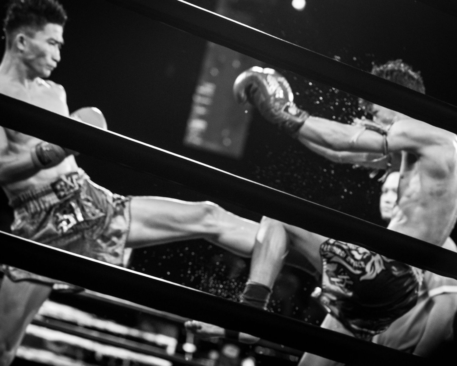Muay Thai fighters engage at Rajadamnern Stadium, Bangkok, Thailand.