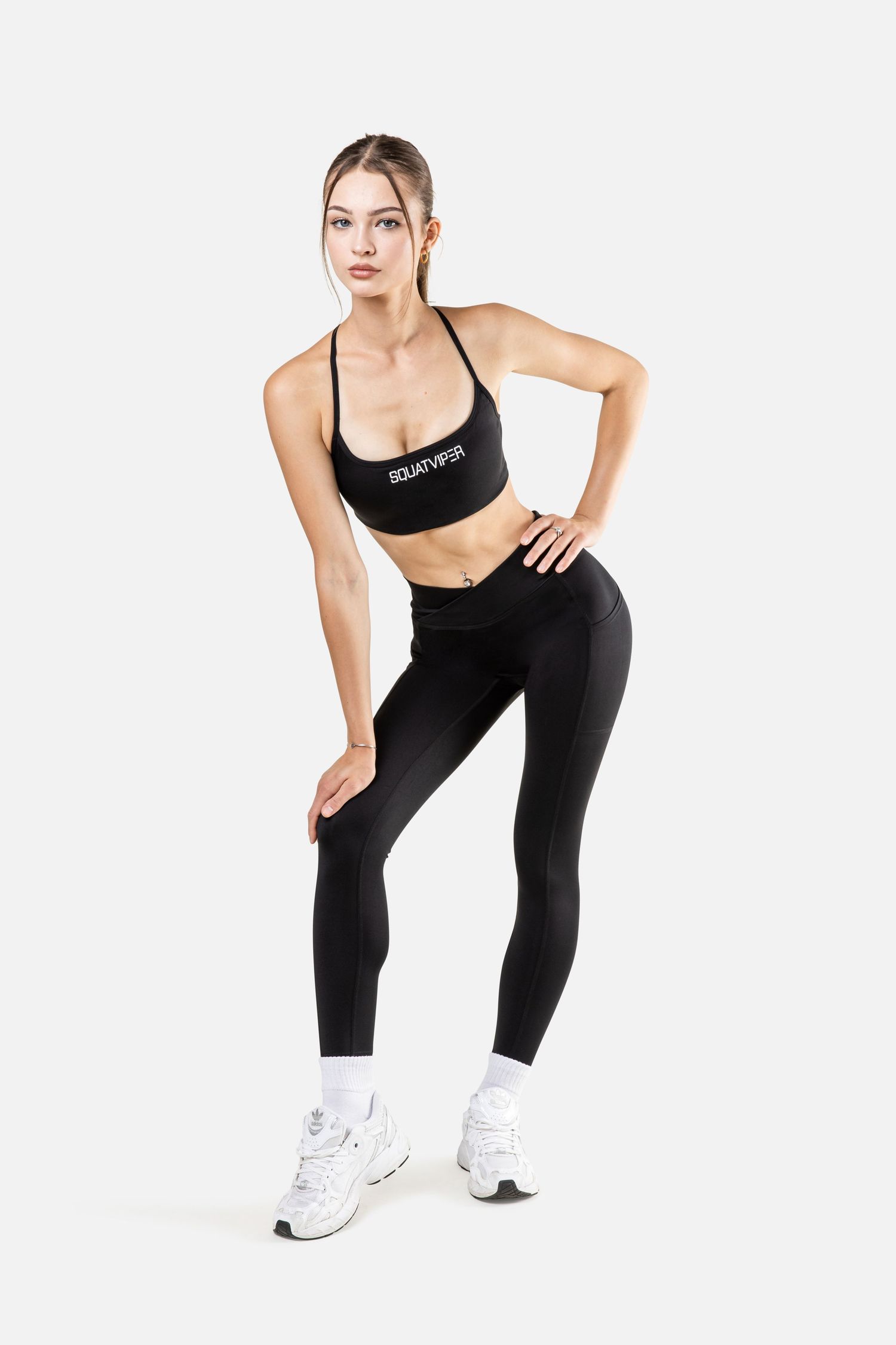 Athletic woman in black workout attire demonstrating stretching poses against white background.