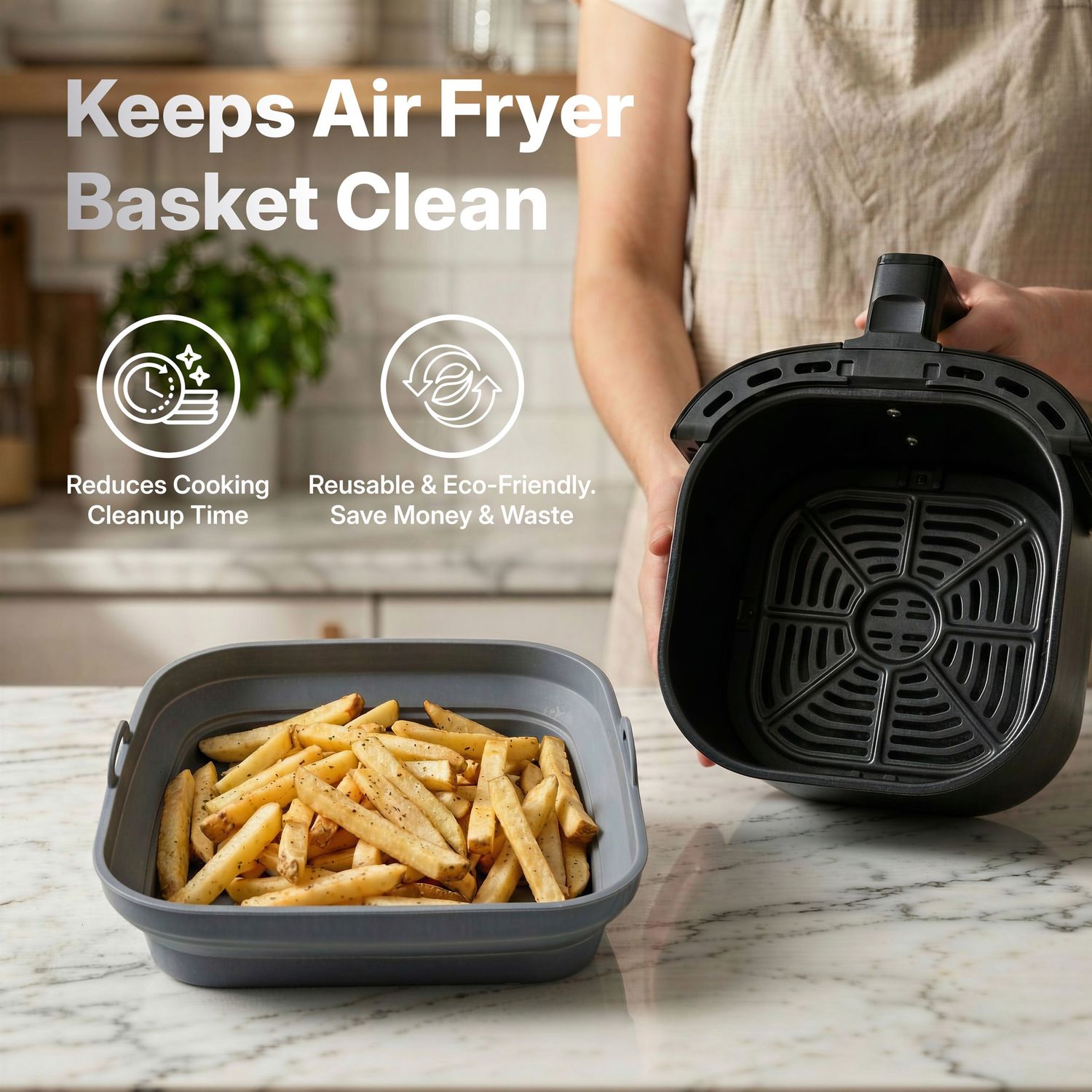 Air fryer basket filled with crispy french fries next to an empty non-stick cooking basket on marble countertop.