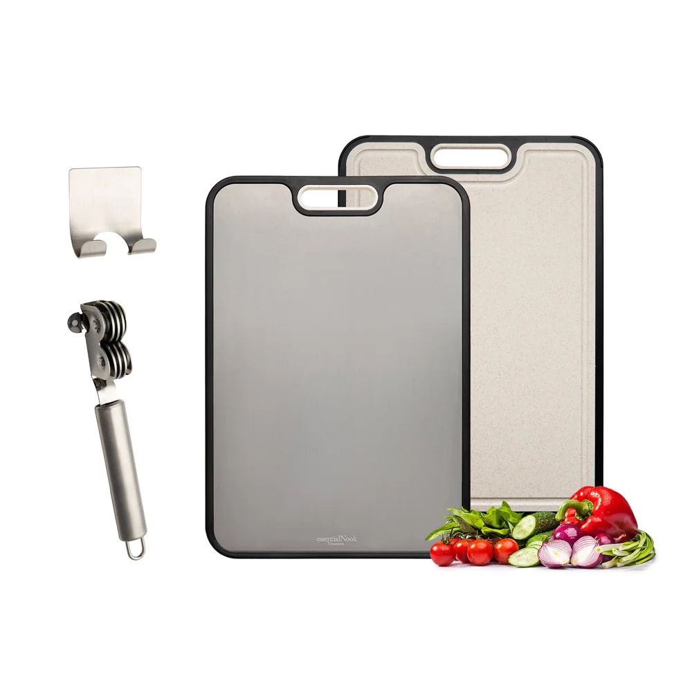 Product layout of cutting boards with knife sharpener and fresh vegetables for food preparation.