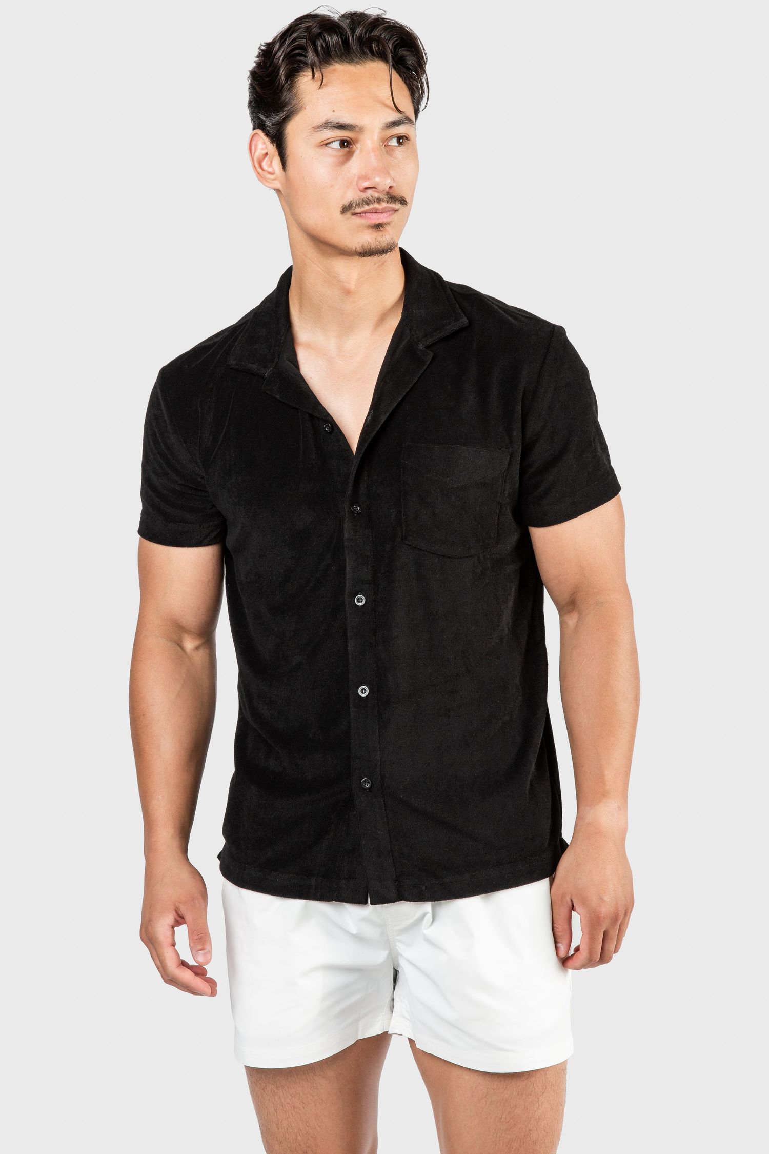 Black button-up short sleeve shirt paired with white shorts shown in multiple poses.
