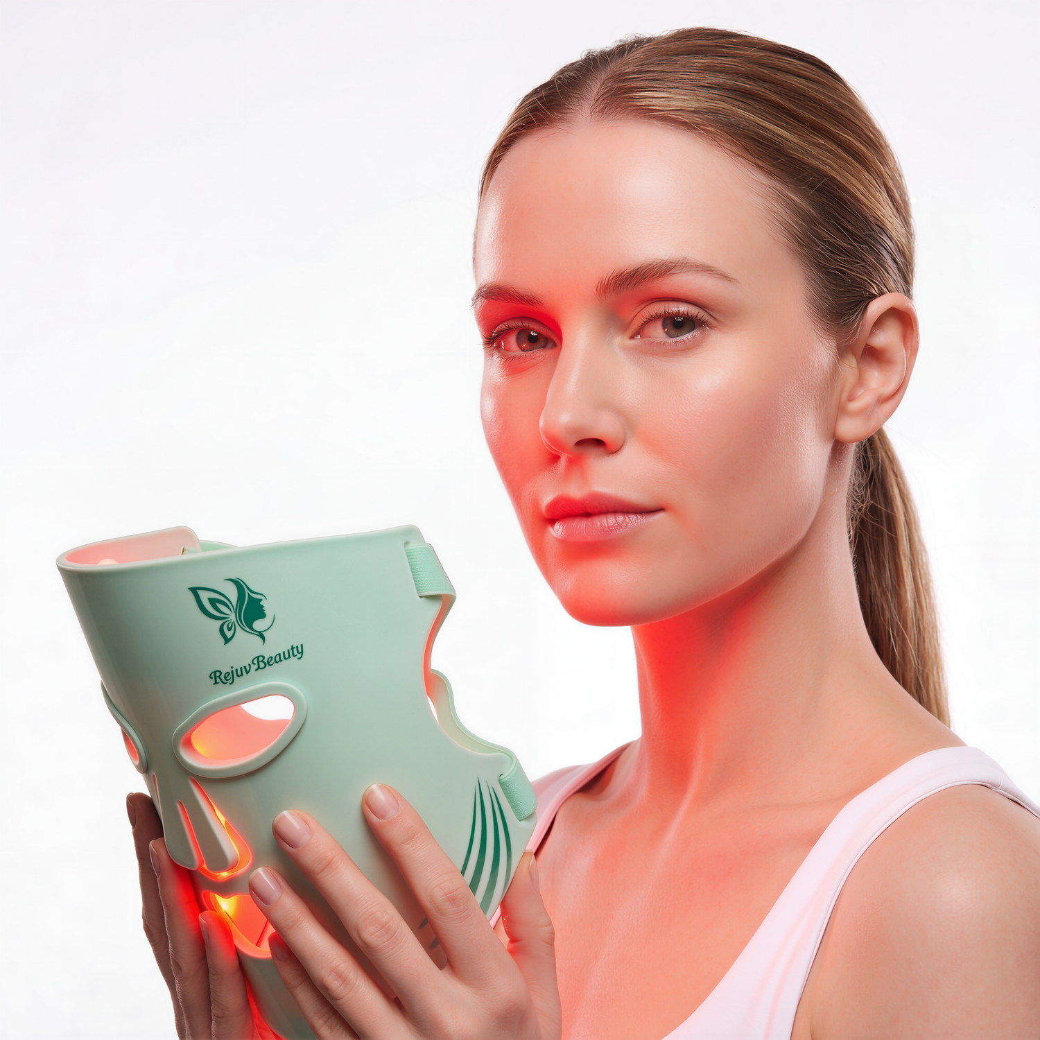 Person holding and drinking from a mint green Starbucks cup with red lighting in a studio setting.