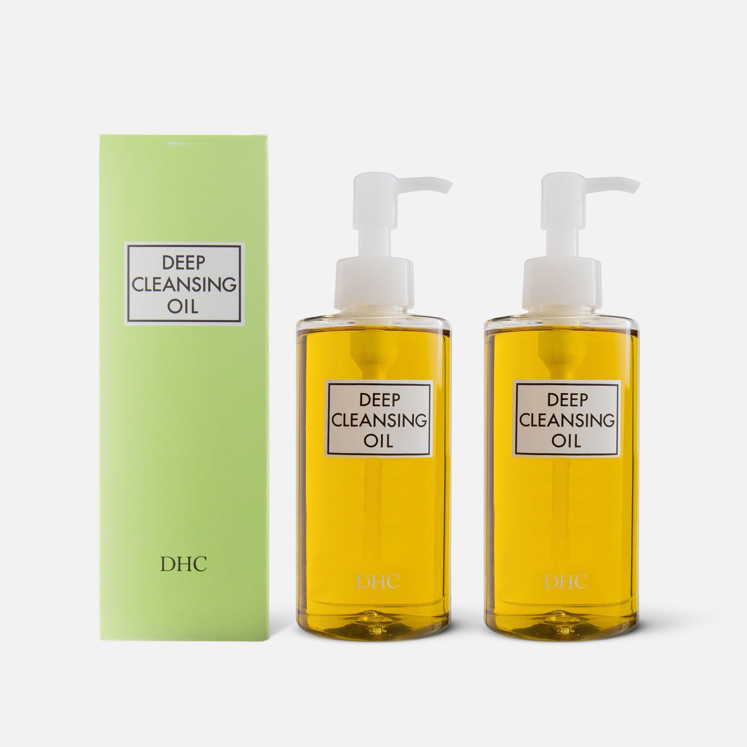 DHC Deep Cleansing Oil bottles displayed with green packaging.