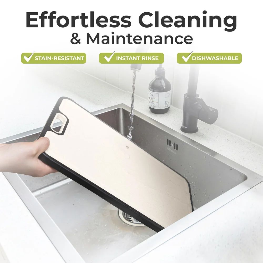 Cutting board being cleaned in kitchen sink demonstrating stain resistance and dishwasher safe features.