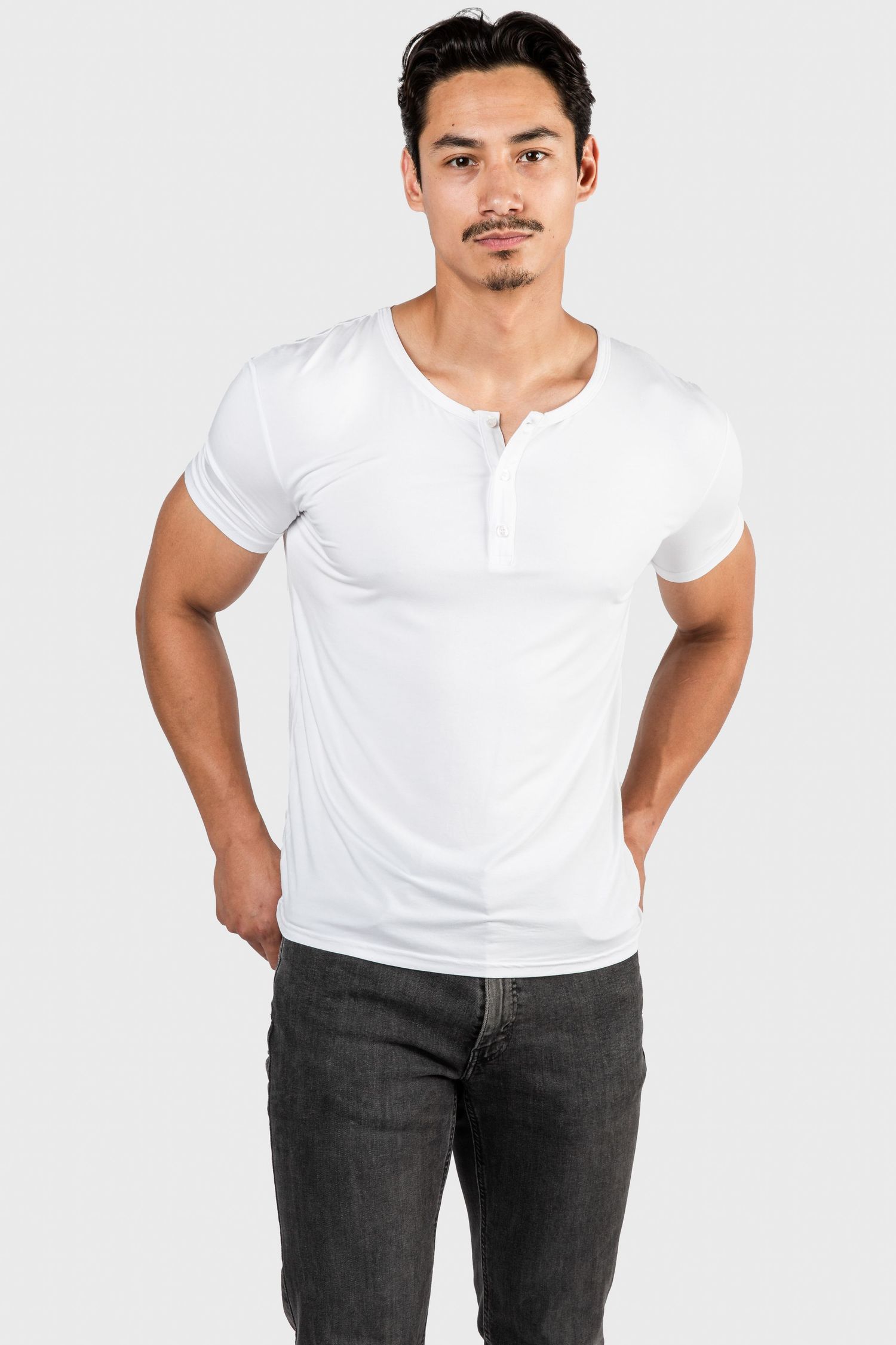 Casual outfit featuring white henley shirt and dark jeans shown from different angles.