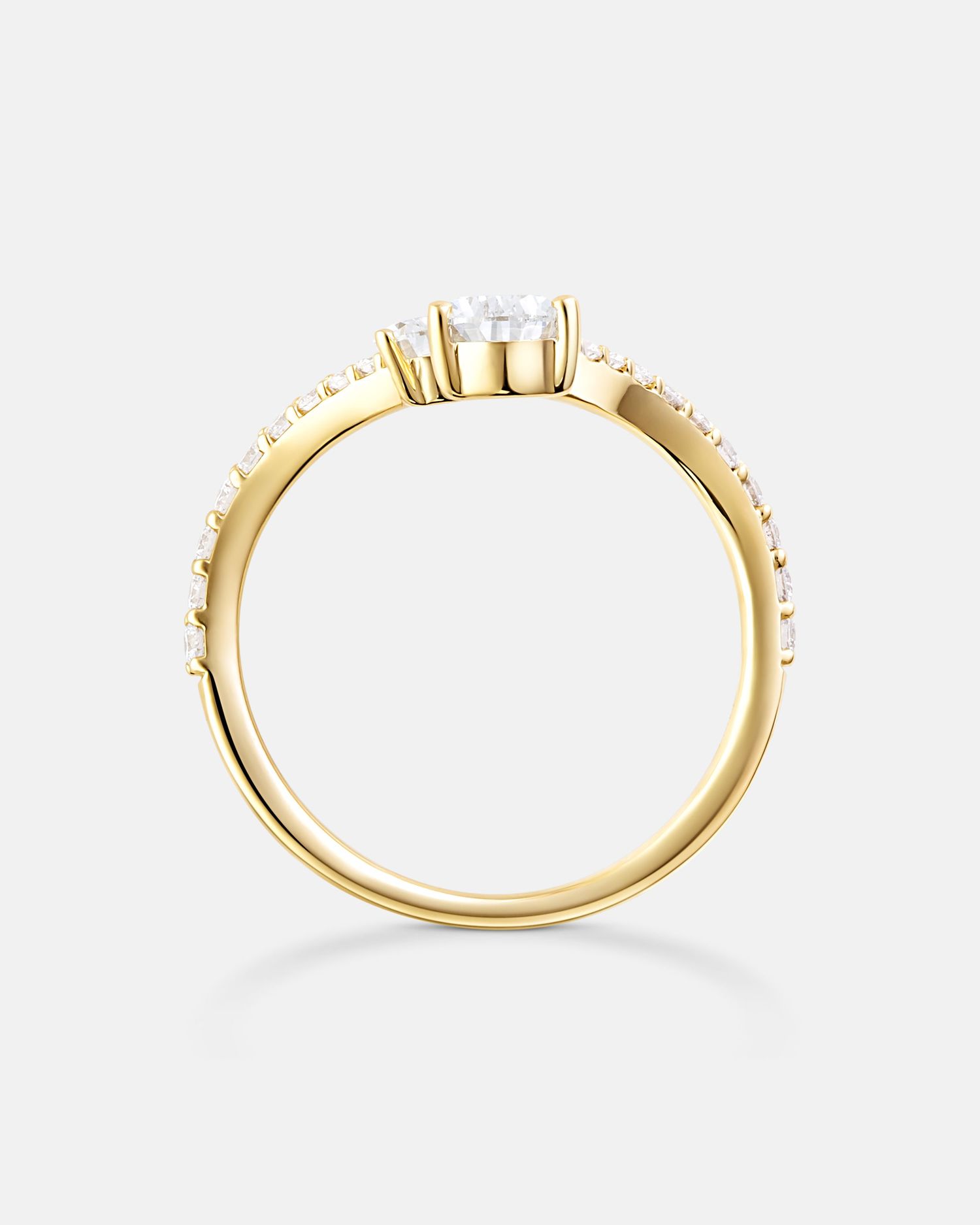 Delicate gold ring with small stones shown from different angles.