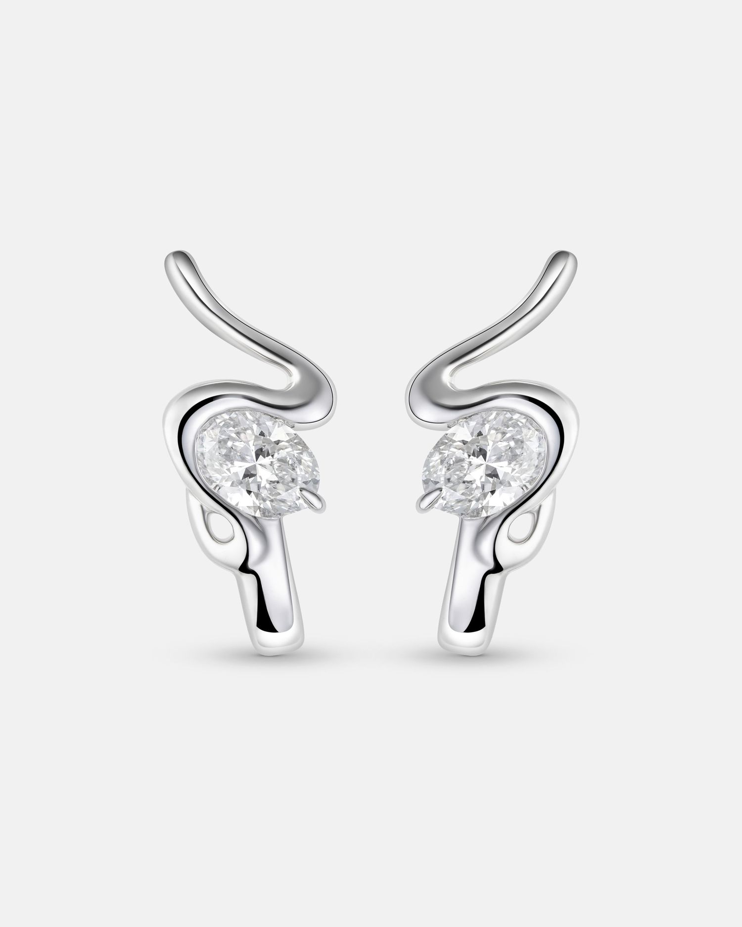 Sterling silver stud earrings with curved design and crystal accents.