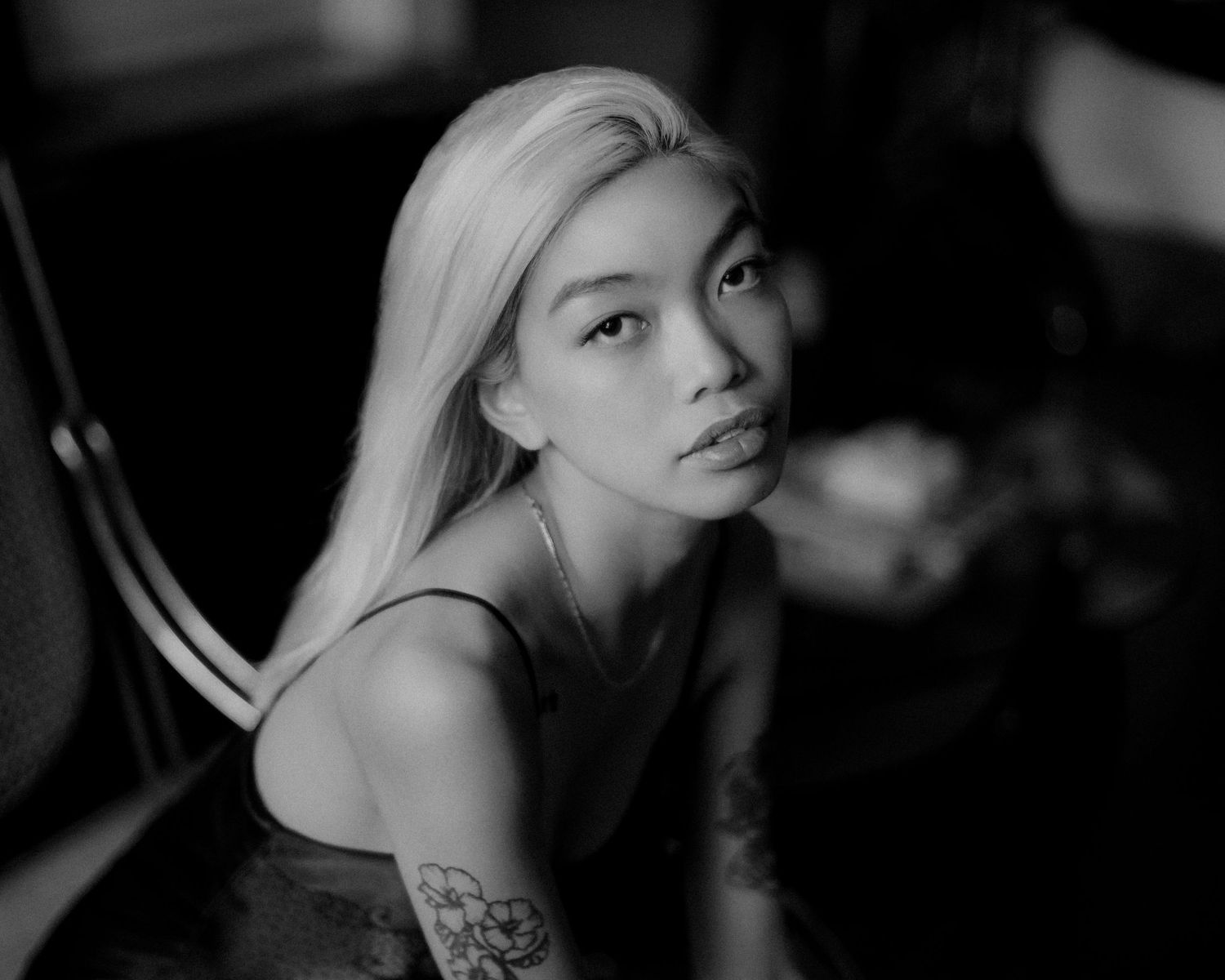 Black and white artistic portraits with dramatic lighting and shadows.