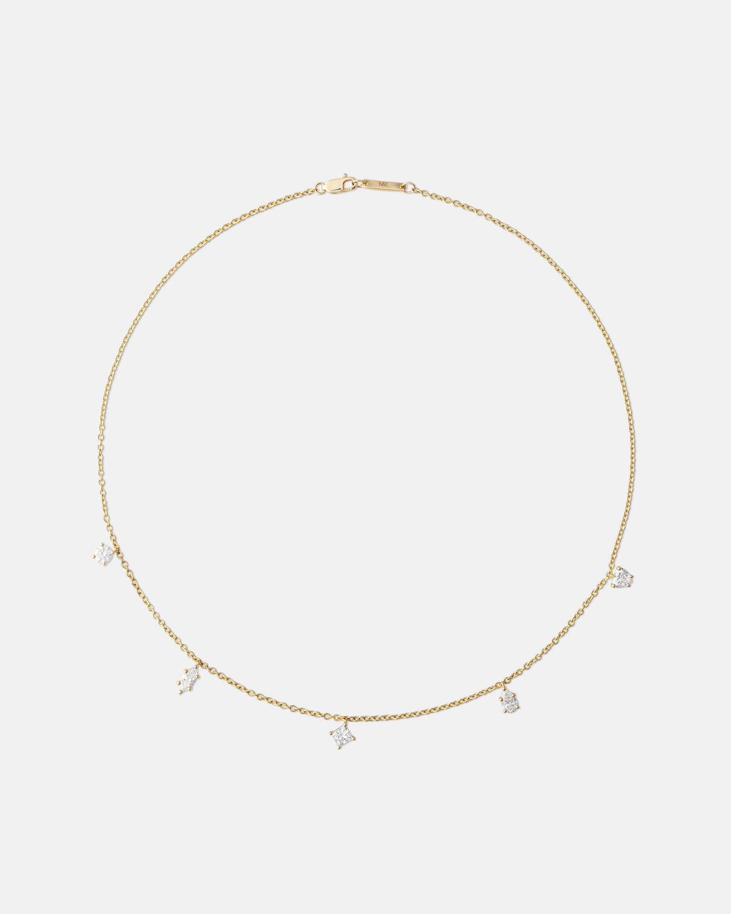 Delicate gold chain necklace with small charms shown from multiple angles.
