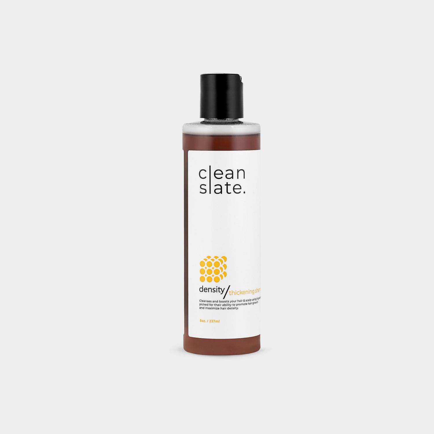 Clean Slate beauty product bottles in minimalist packaging on white background.