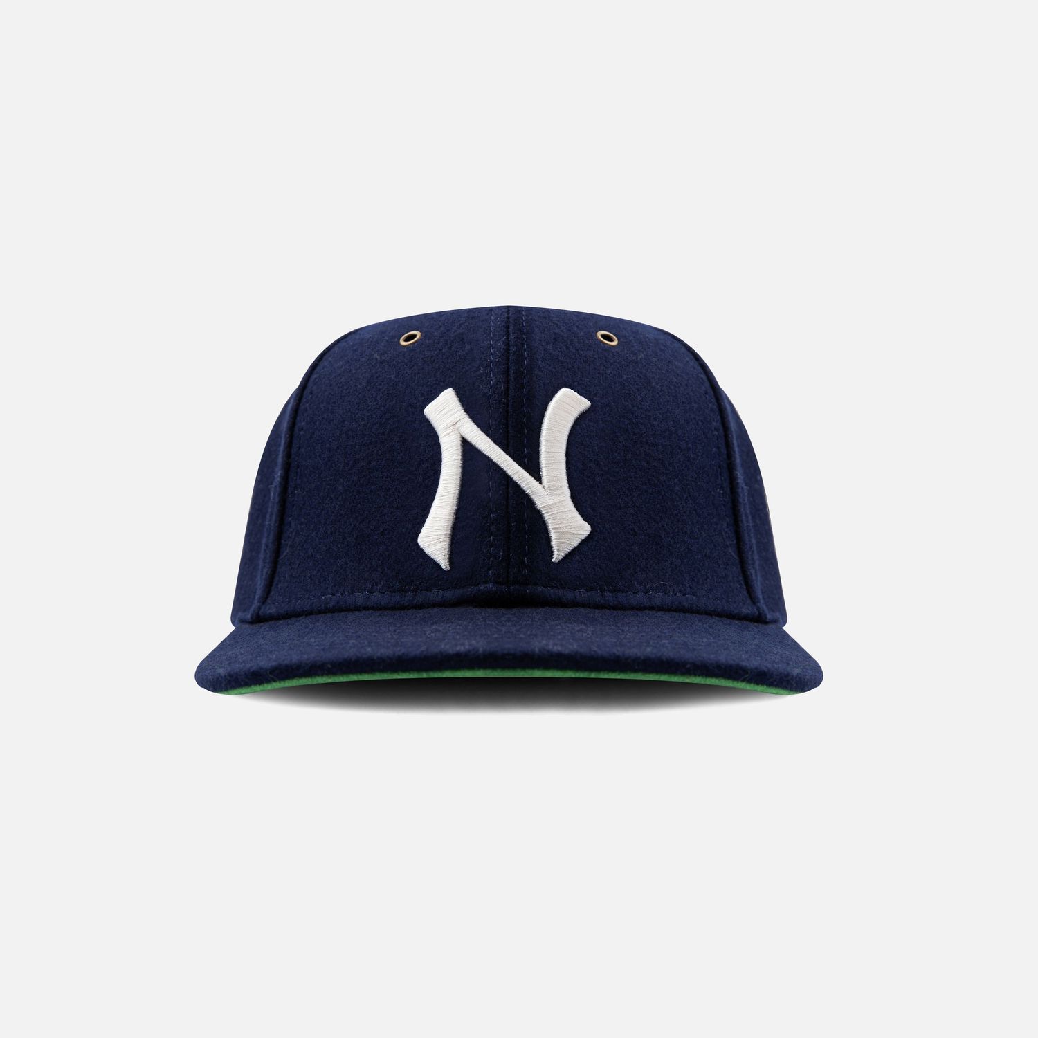 Navy blue baseball cap with white NY Yankees logo shown from different angles.