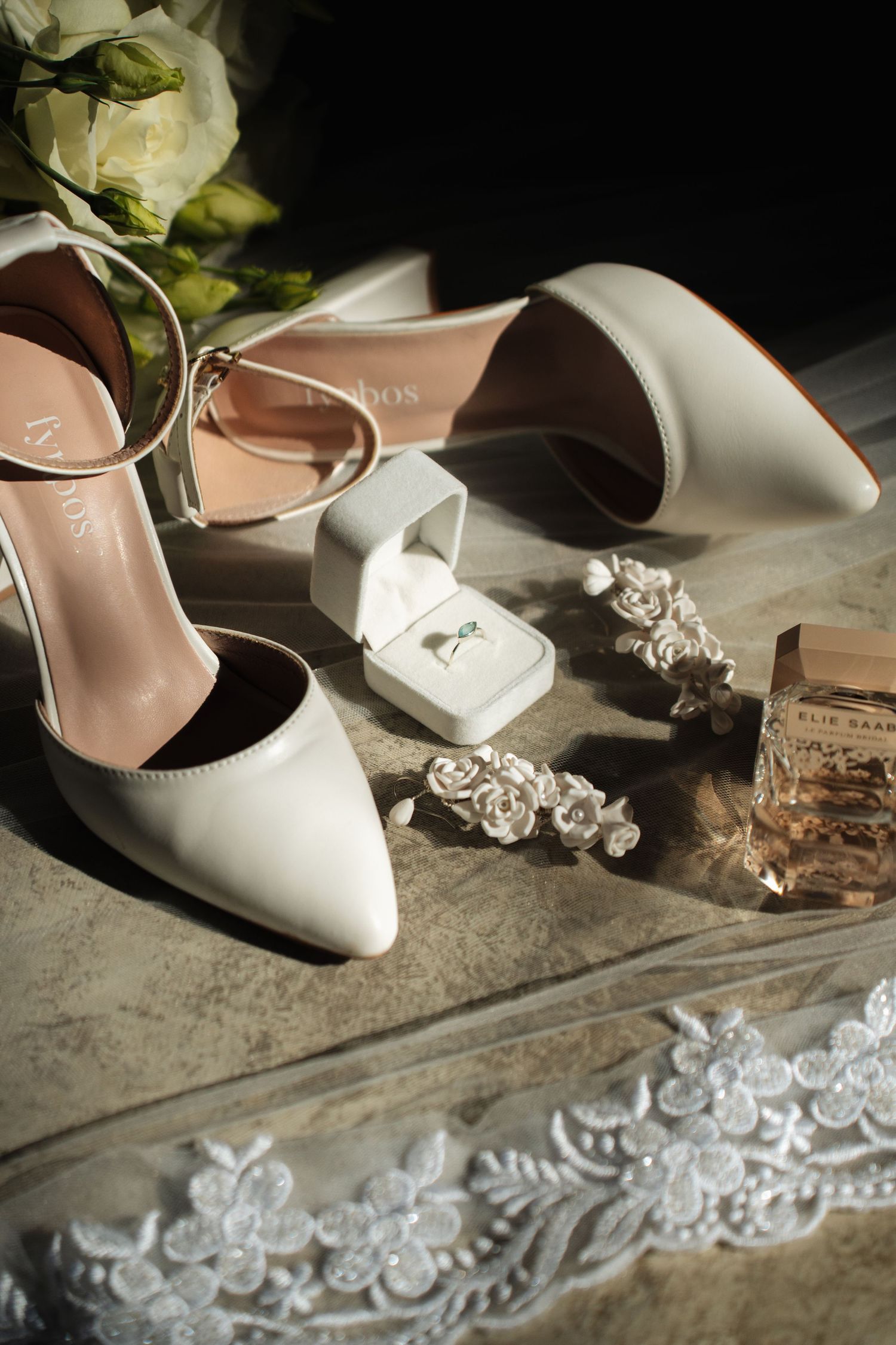 Bridal high-heels and jewellery arranged in a photo taken by Jordie Captures