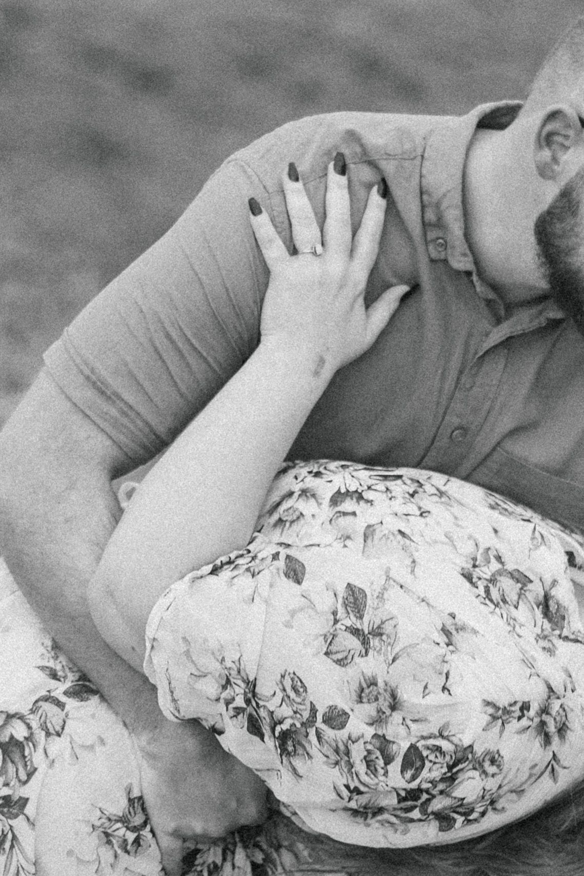 A couple on their engagement shoot in a forest, photo taken by Jordie Captures
