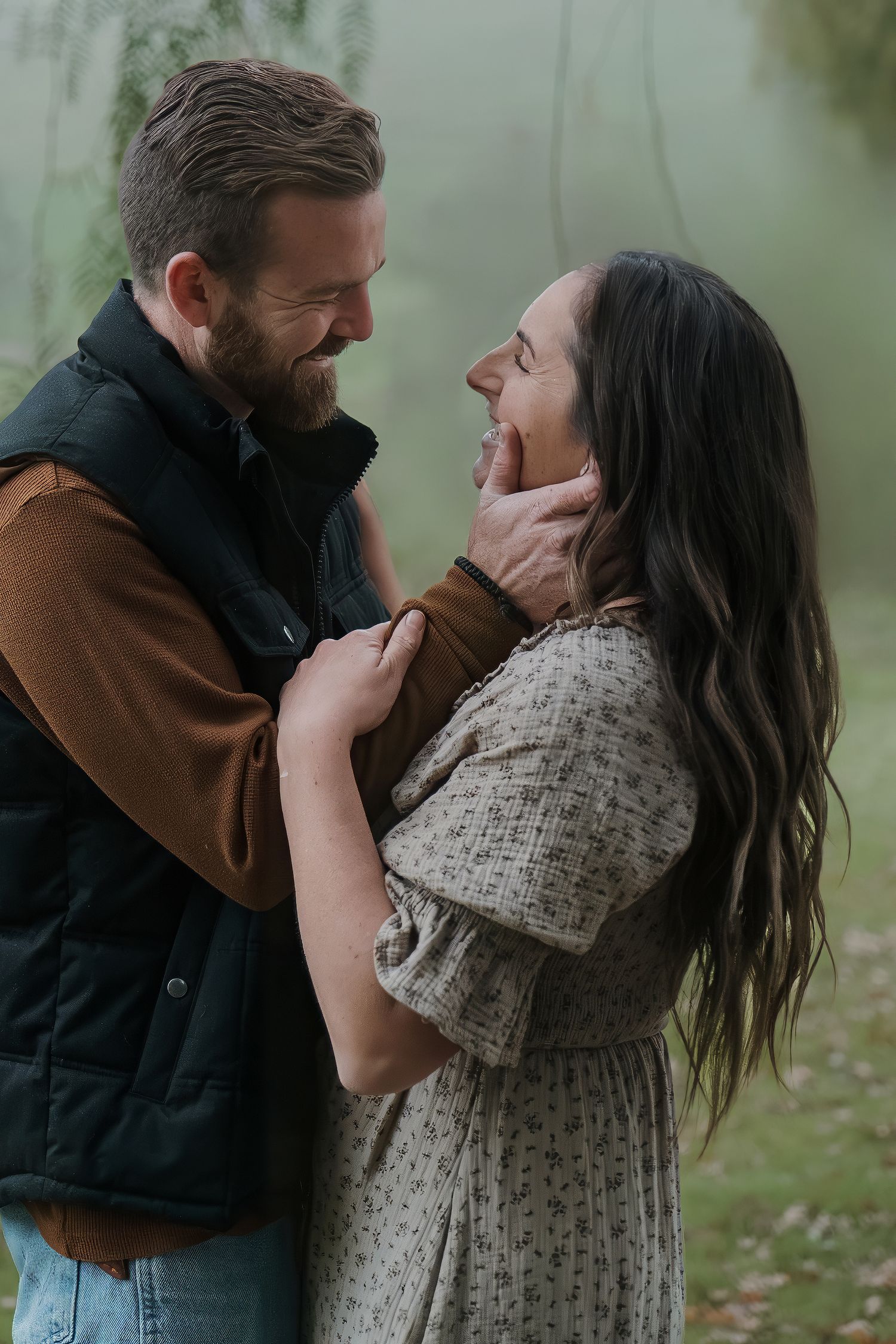 Intimate outdoor portrait showing affection against a misty natural backdrop in Roseville, CA