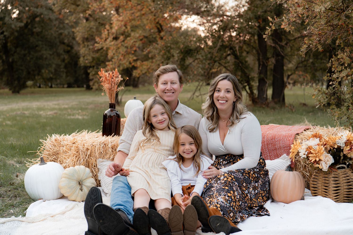 Joyful family picnic scene with autumn decorations and confetti in a park setting in Roseville, CA