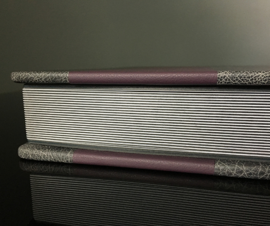 Gray and purple leather bat mitzvah album, combining elegant design with meaningful celebration keepsake.
