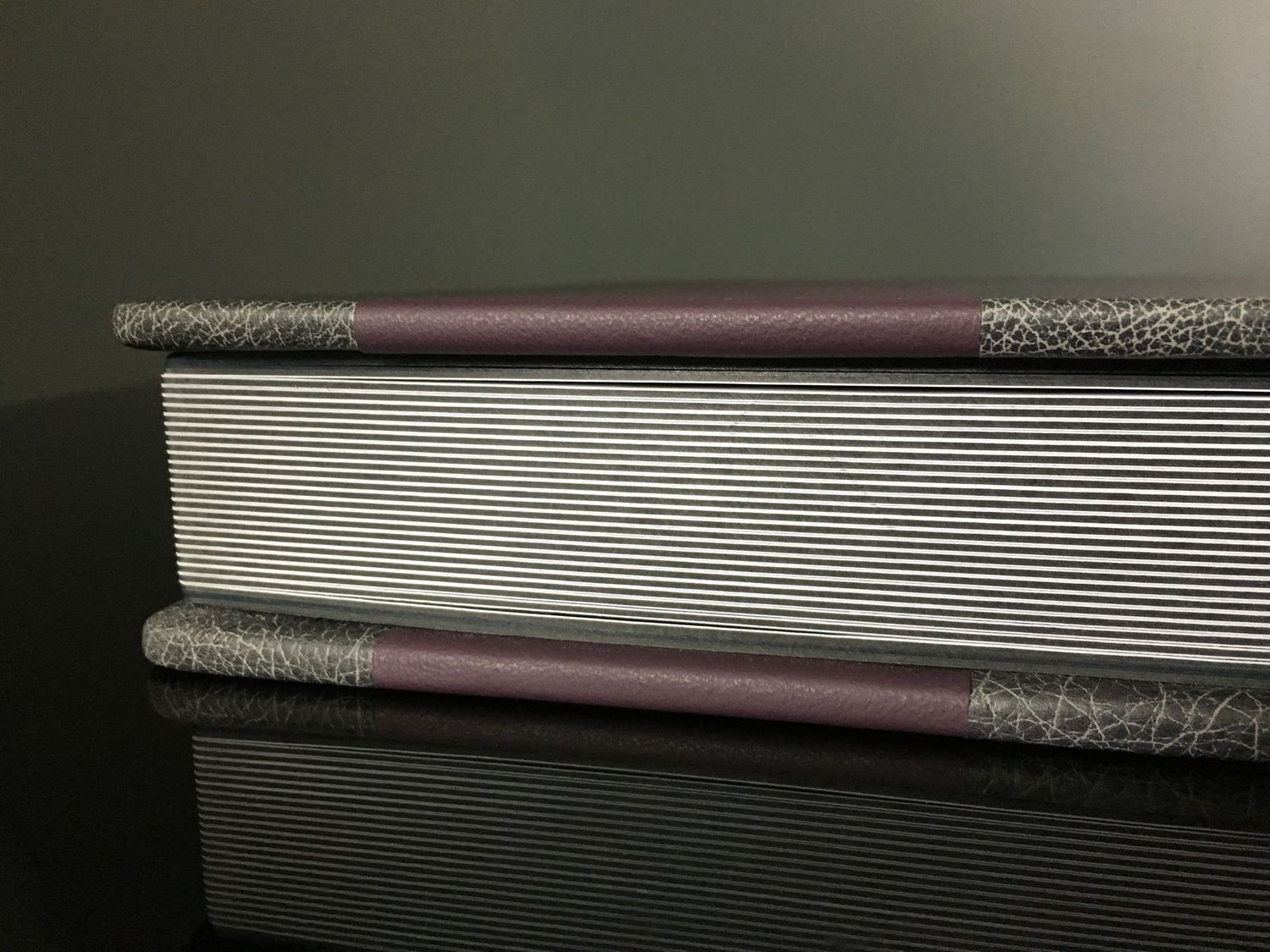 Gray and purple leather bat mitzvah album, combining elegant design with meaningful celebration keepsake.