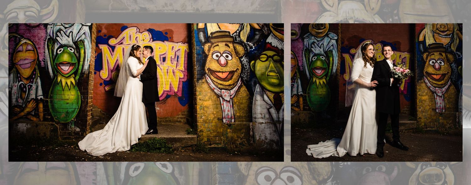 Wedding couple poses in front of colorful graffiti art wall in urban setting creating vibrant photo backdrop.