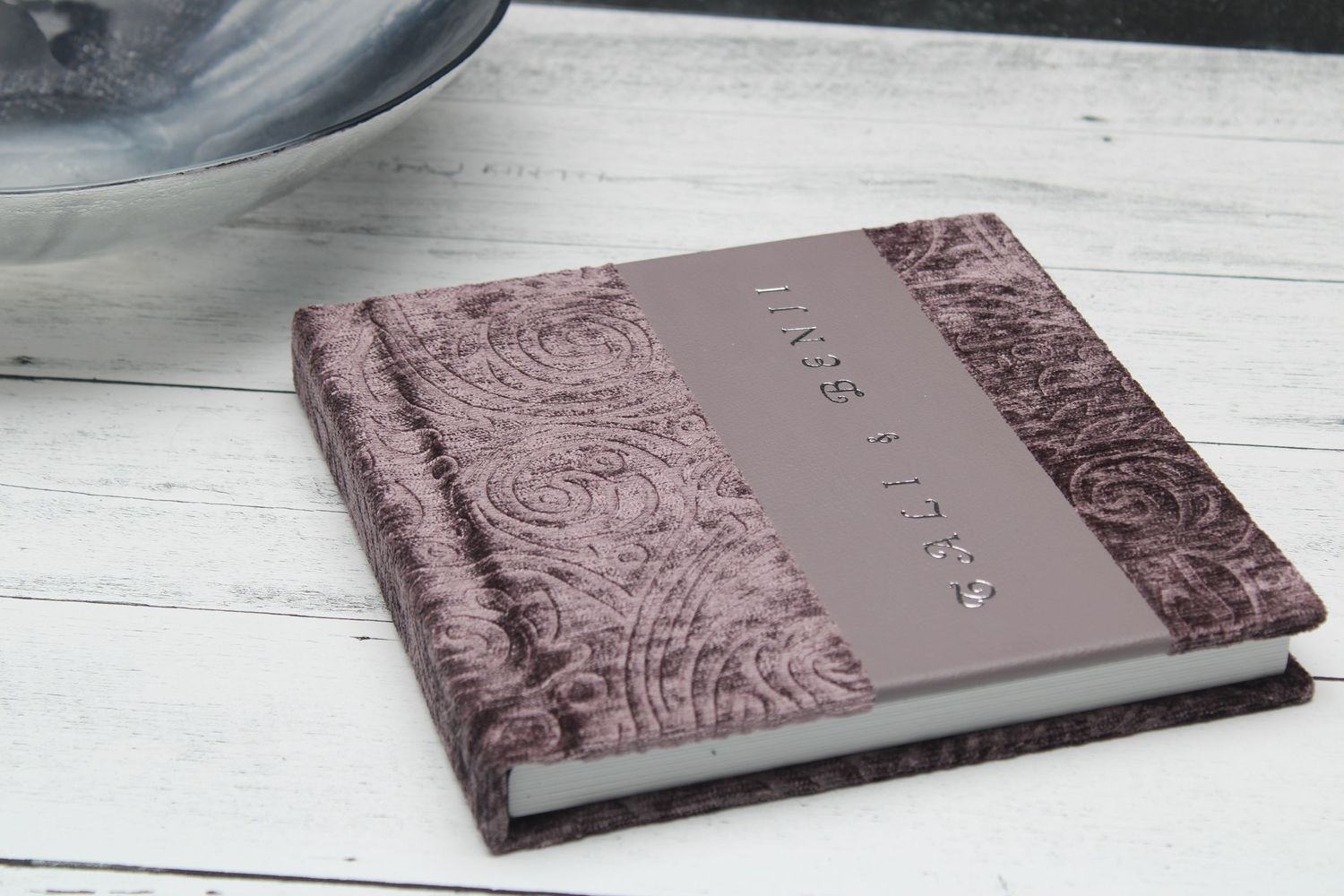 Purple textured velvet photo album cover with vertical leather stripe and unique vertical text display