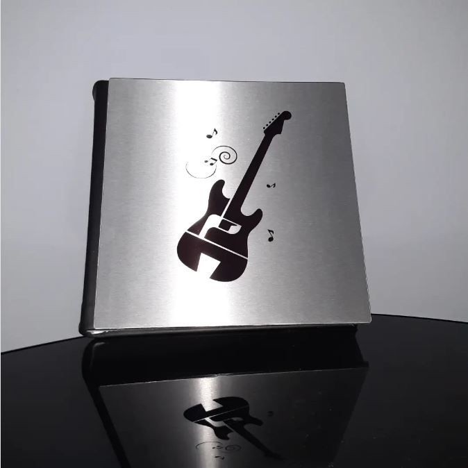 Metal custom photo album cover featuring a famous guitaris's logo imprinted on sleek metal design