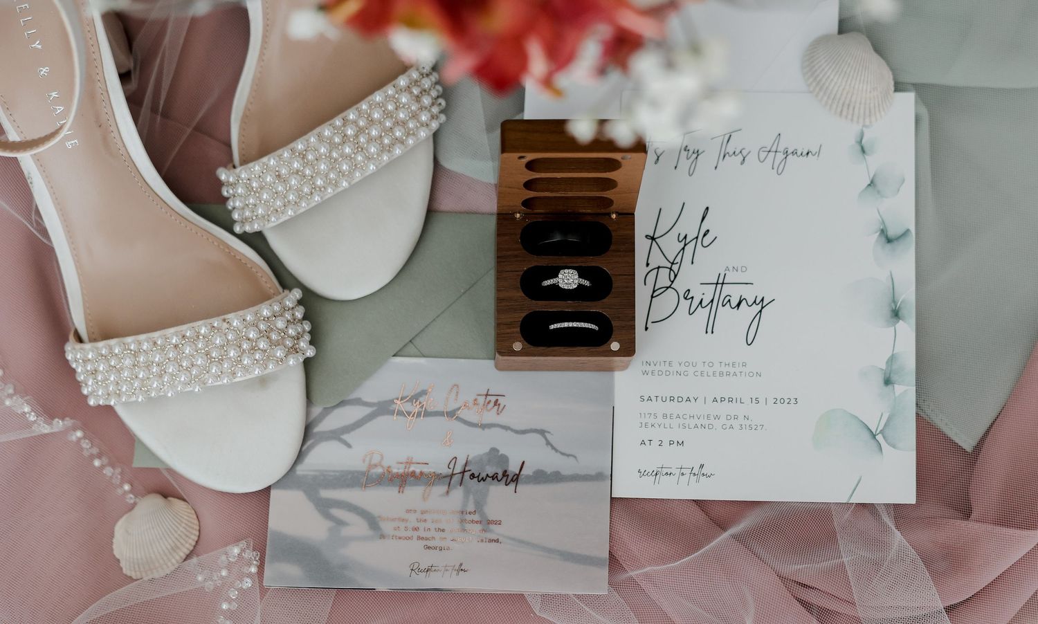 Pastel wedding stationery and invitation details with floral accents.