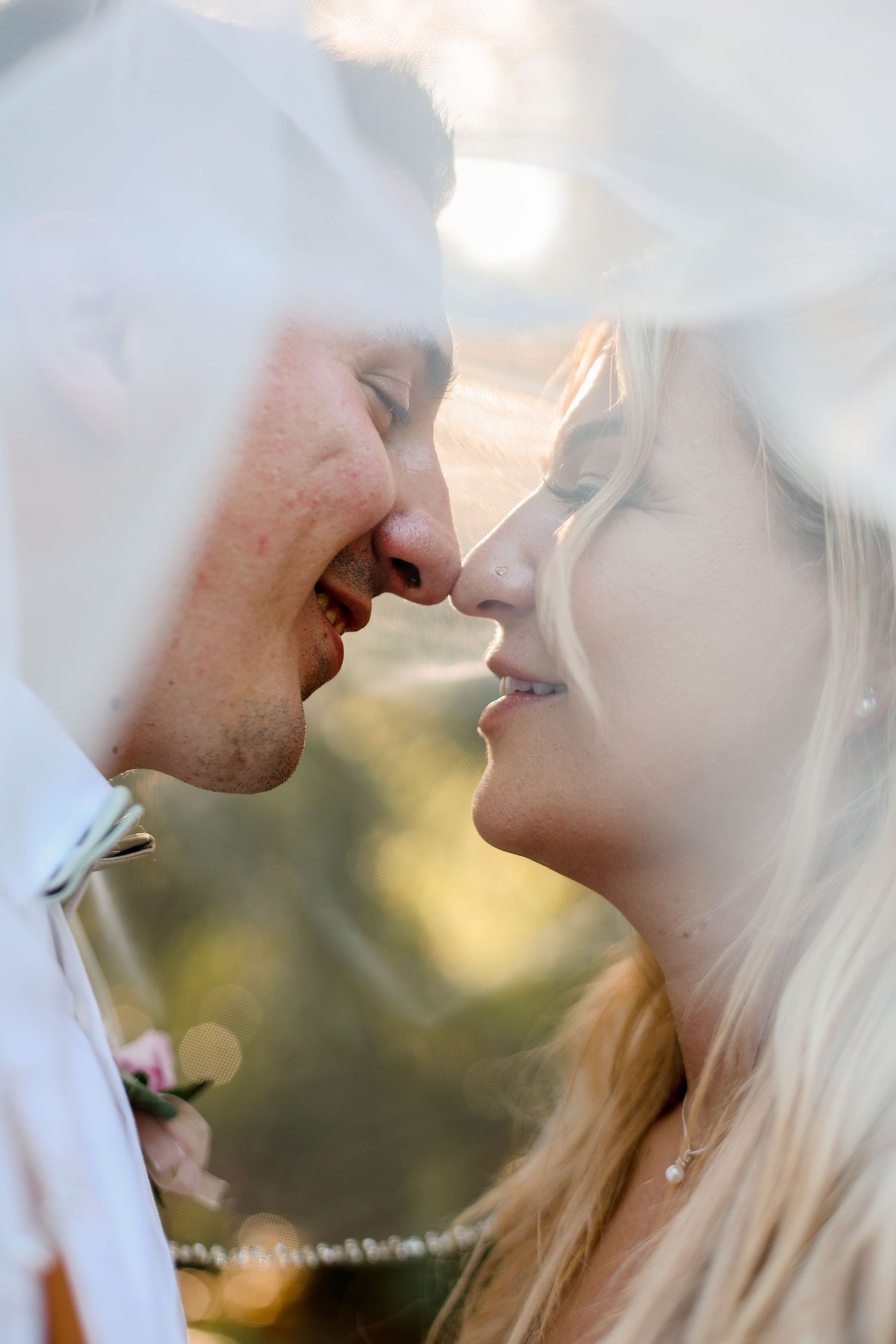 Ethereal close-up of couple sharing an intimate moment during sunset.