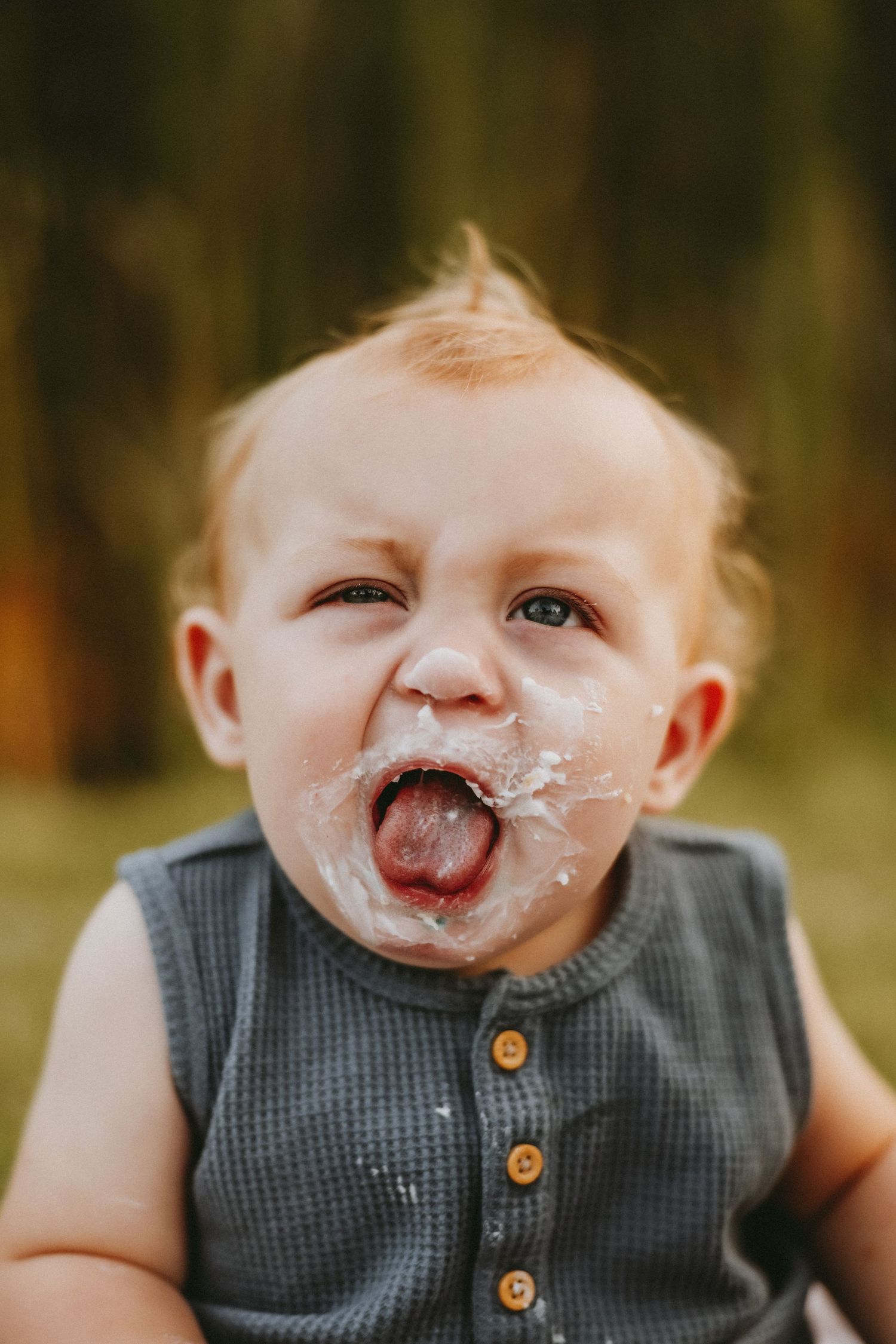 A series of photos showing a child in a gray button vest enjoying ice cream with messy smears around their mouth.