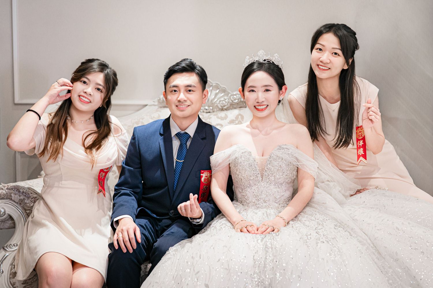 Wedding party members share joyful moments together in a series of formal portraits against a light background.