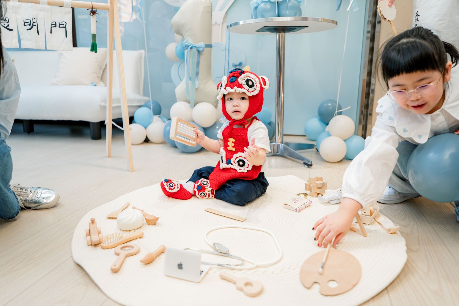Medical students practice infant care techniques with training dolls in a clinical education setting.