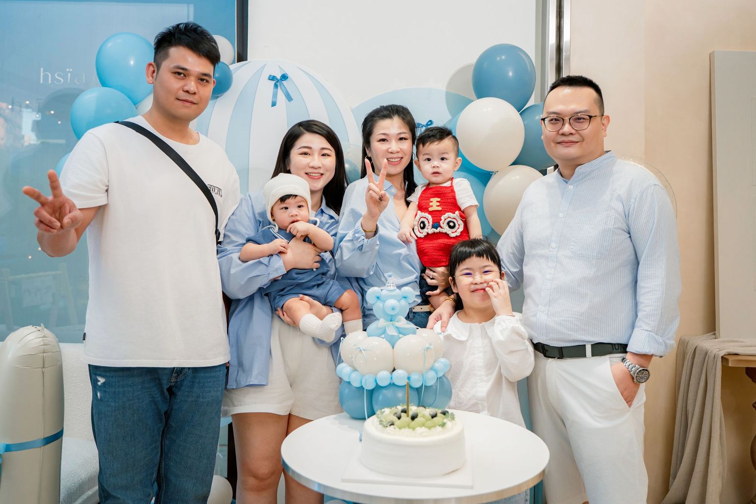 A collage of birthday party moments showing cake, decorations and celebration in light blue and white theme.