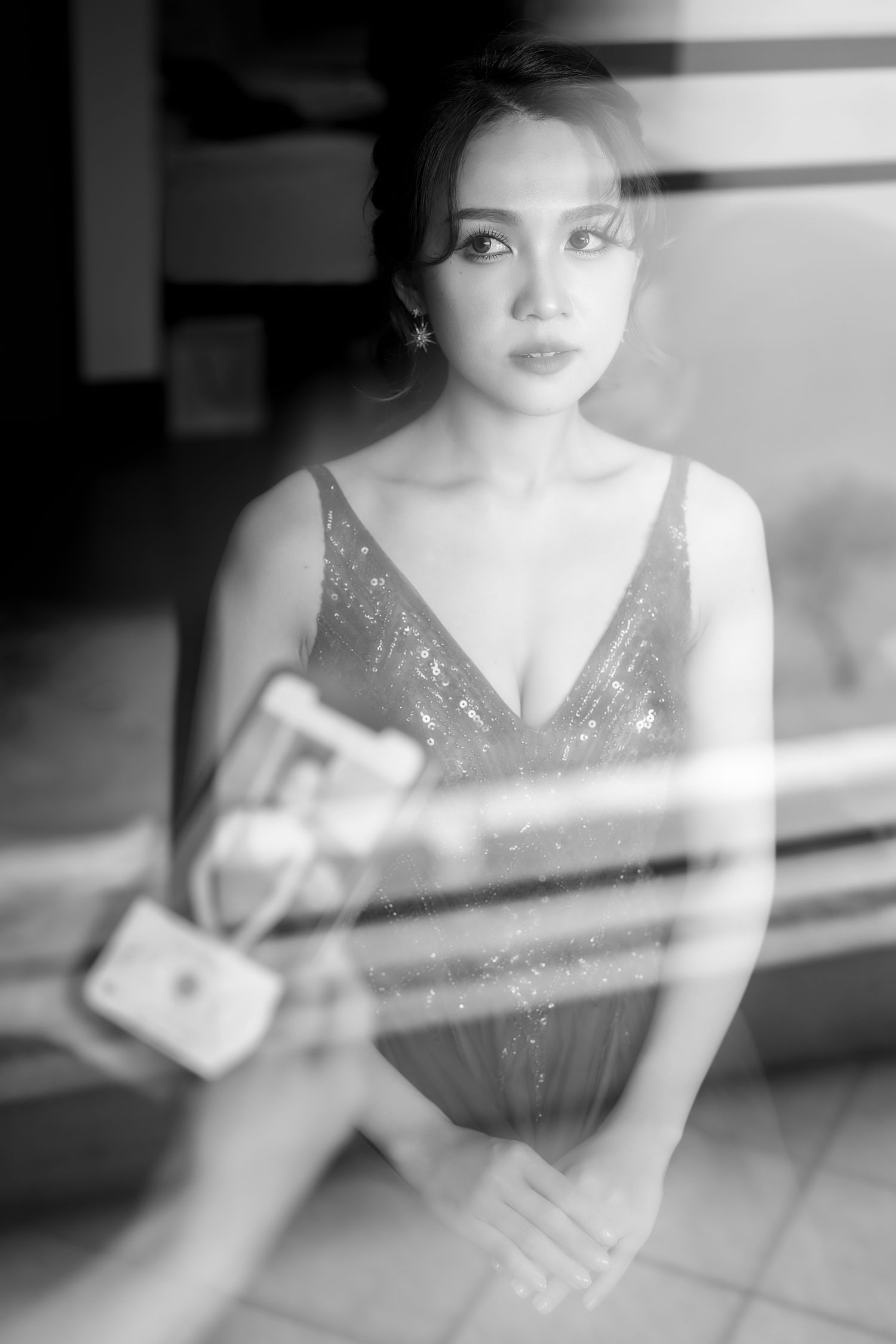 Soft focus black and white portrait in sparkling evening dress.