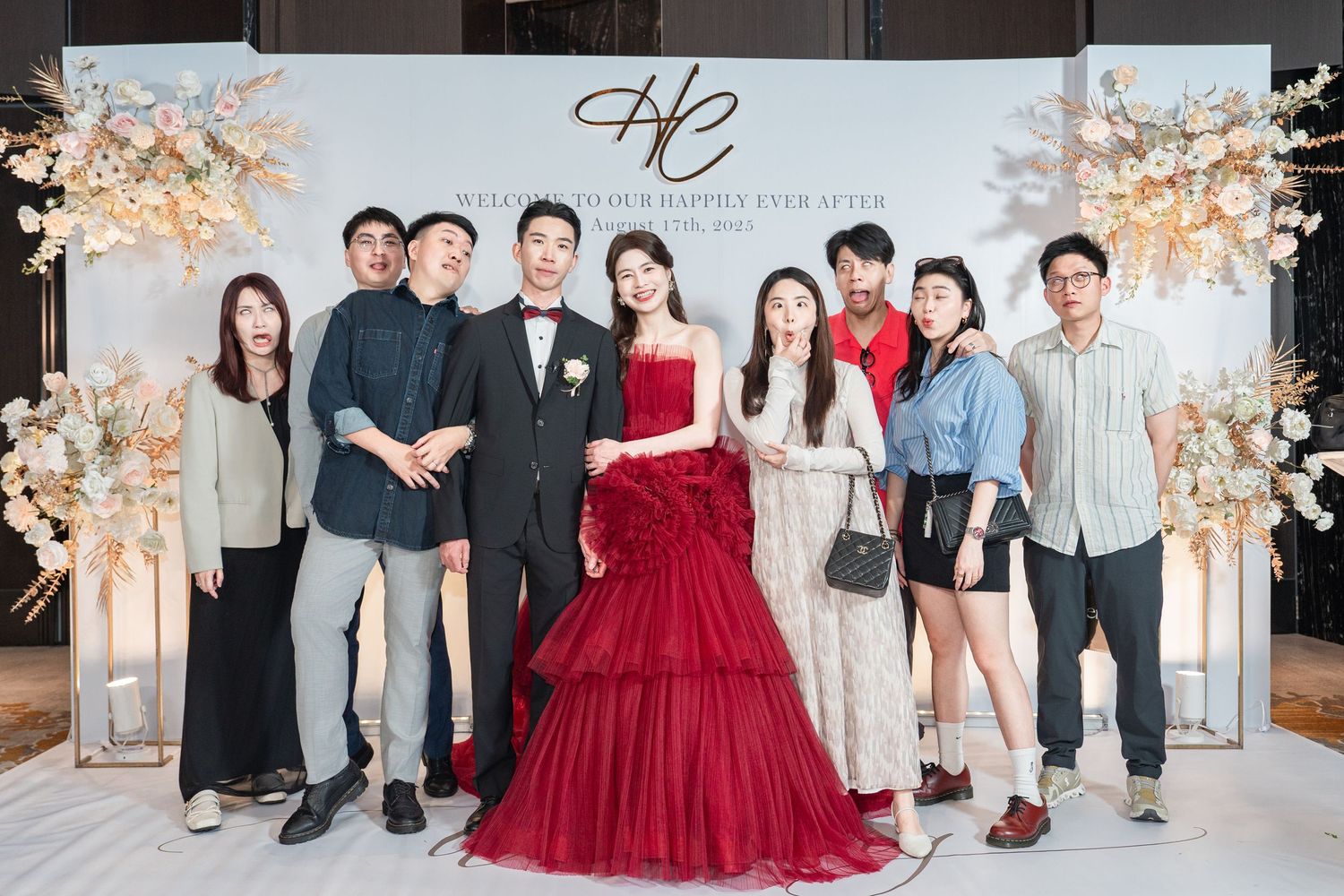 A series of group photos at an elegant party with a red gown as the focal point against light decor and floral arrangements.