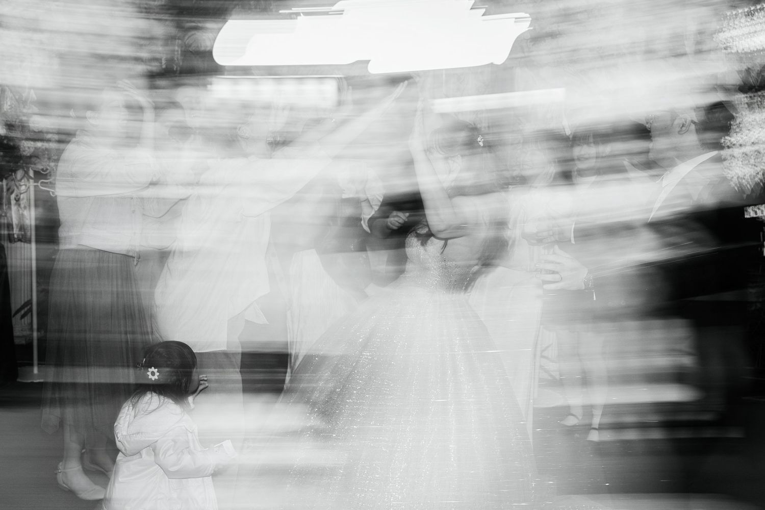 Abstract black and white photograph showing blurred motion and streaks creating an ethereal atmospheric effect.