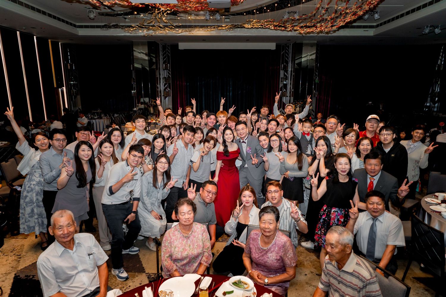 A collection of five photographs showing large groups of people celebrating at what appears to be an indoor event or party.
