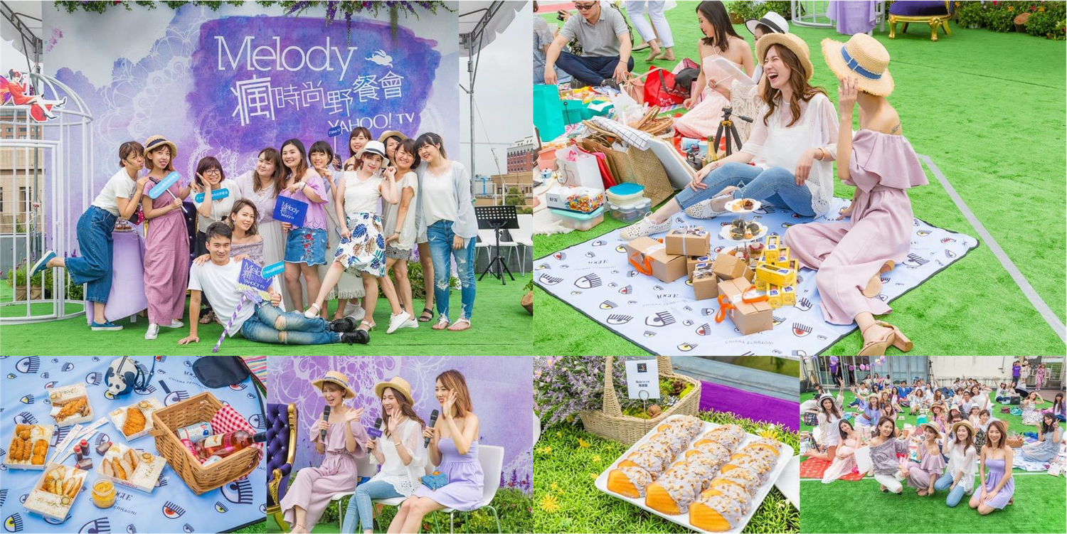 Outdoor picnic and social gathering with decorations on grass lawn.