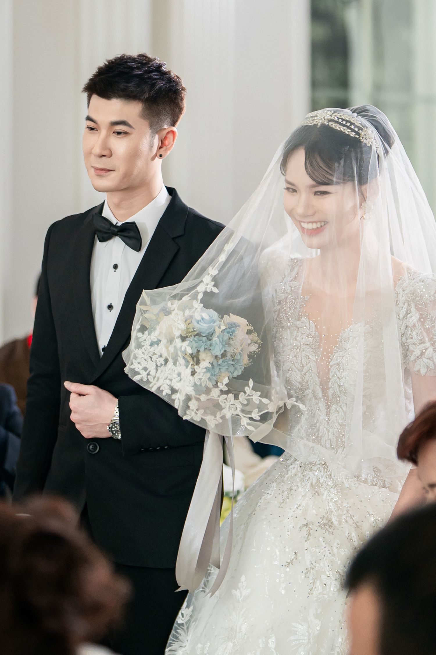 A series of wedding ceremony photos showing a couple in formal attire with the bride wearing a delicate lace veil.