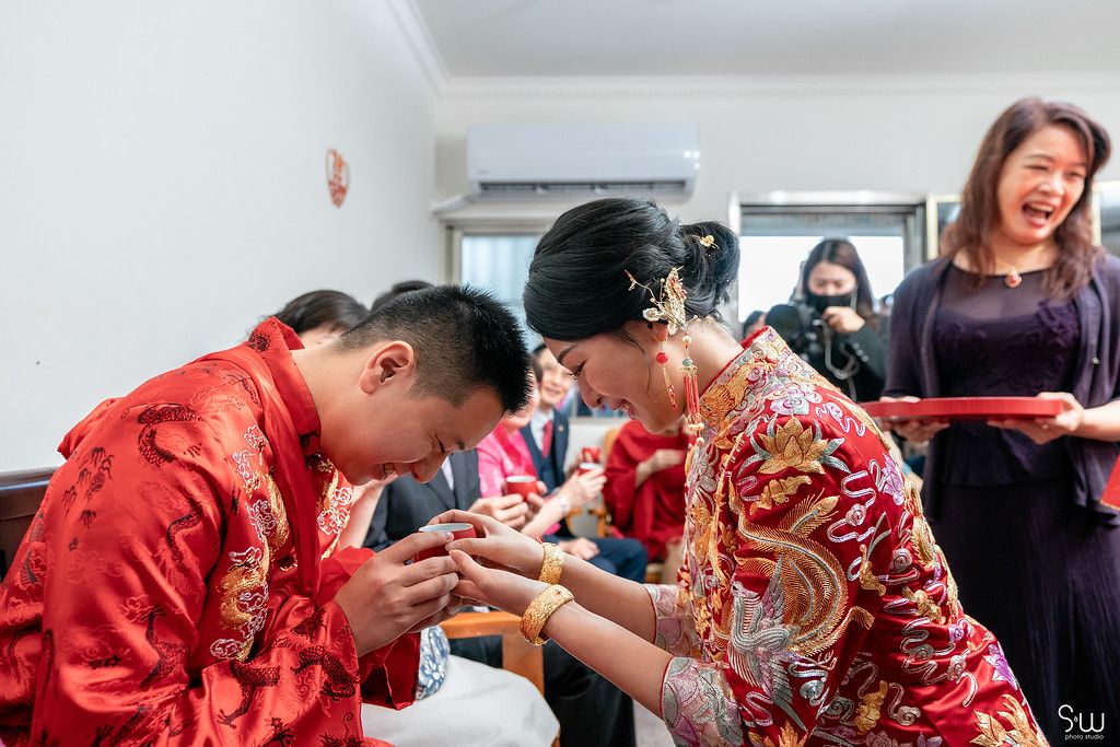 Chinese wedding tea ceremony showing traditional customs and gestures of respect.