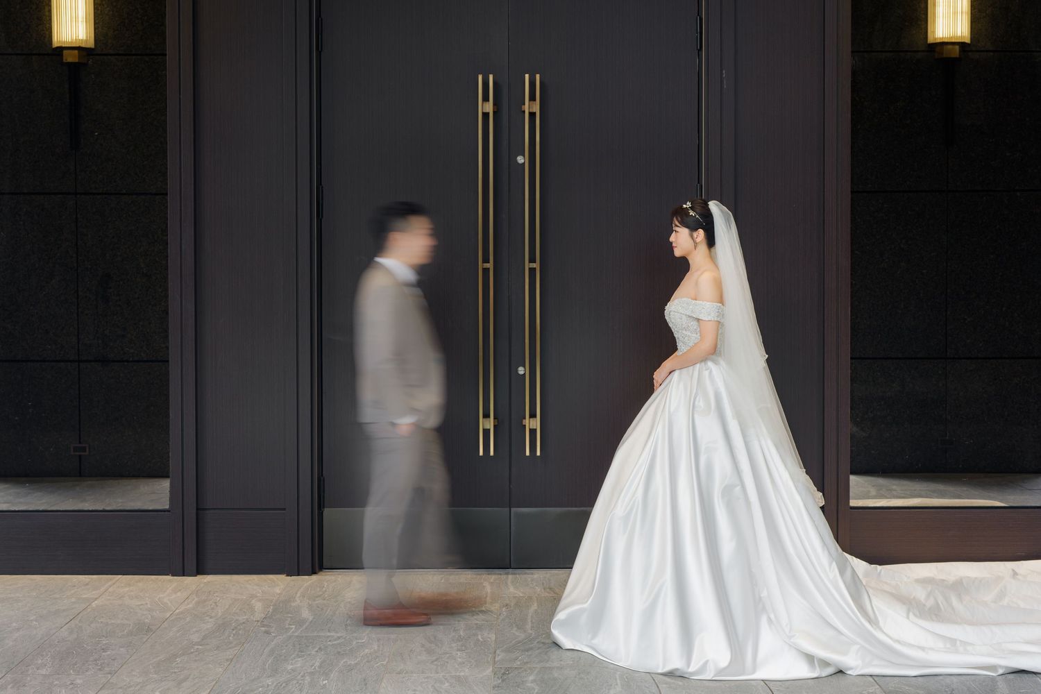 A sequence of wedding dress photos showing a flowing white gown with train in a dark modern setting.