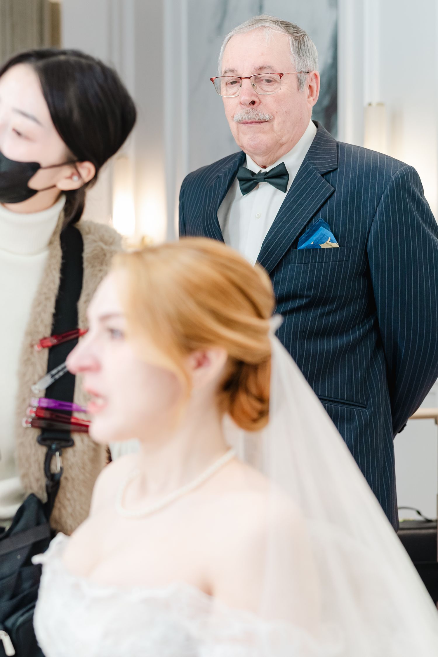 Formal wedding preparation scene with traditional attire and elegant styling.