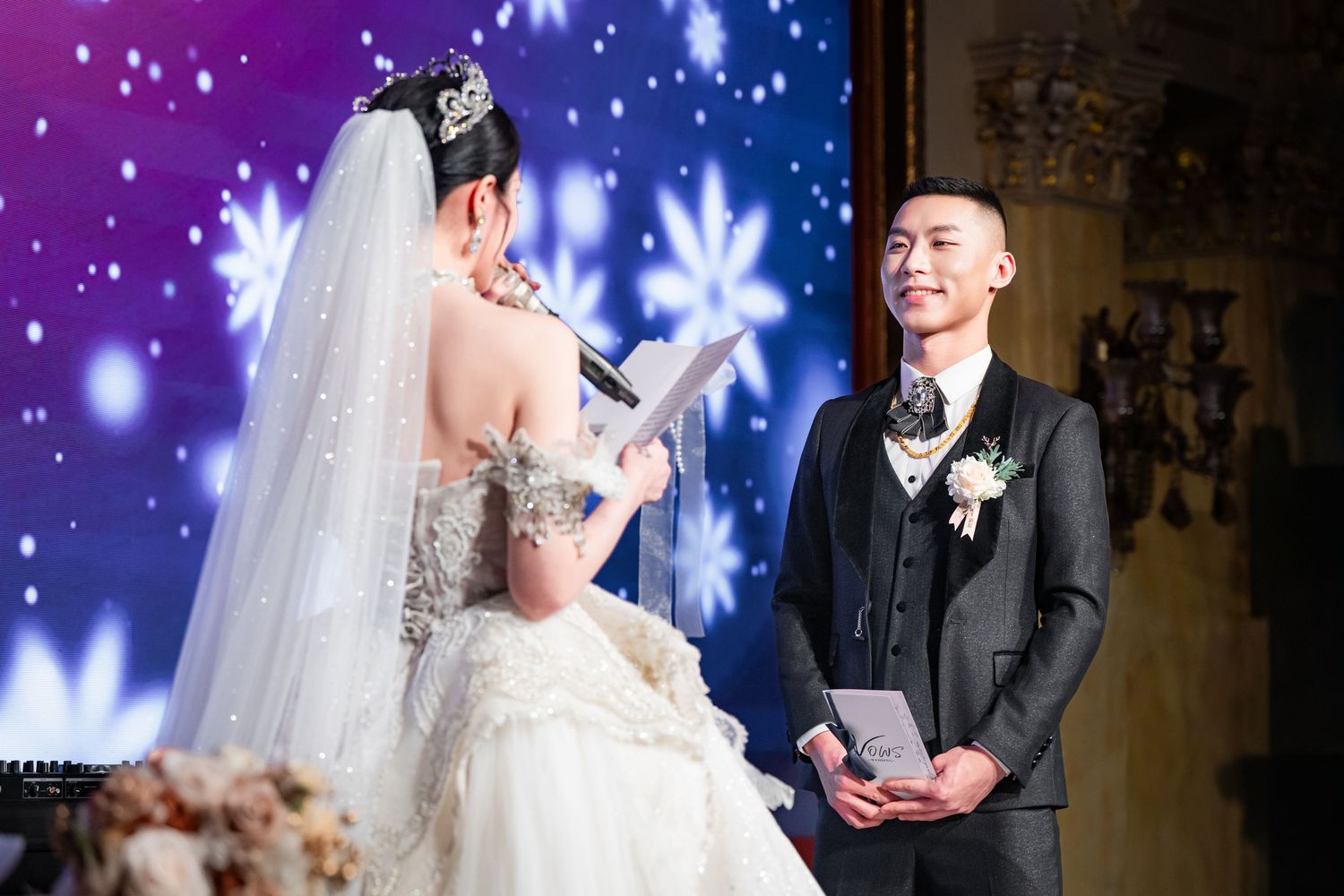 A romantic wedding scene with glowing lights and sparkles creating a magical atmosphere during the ceremony.