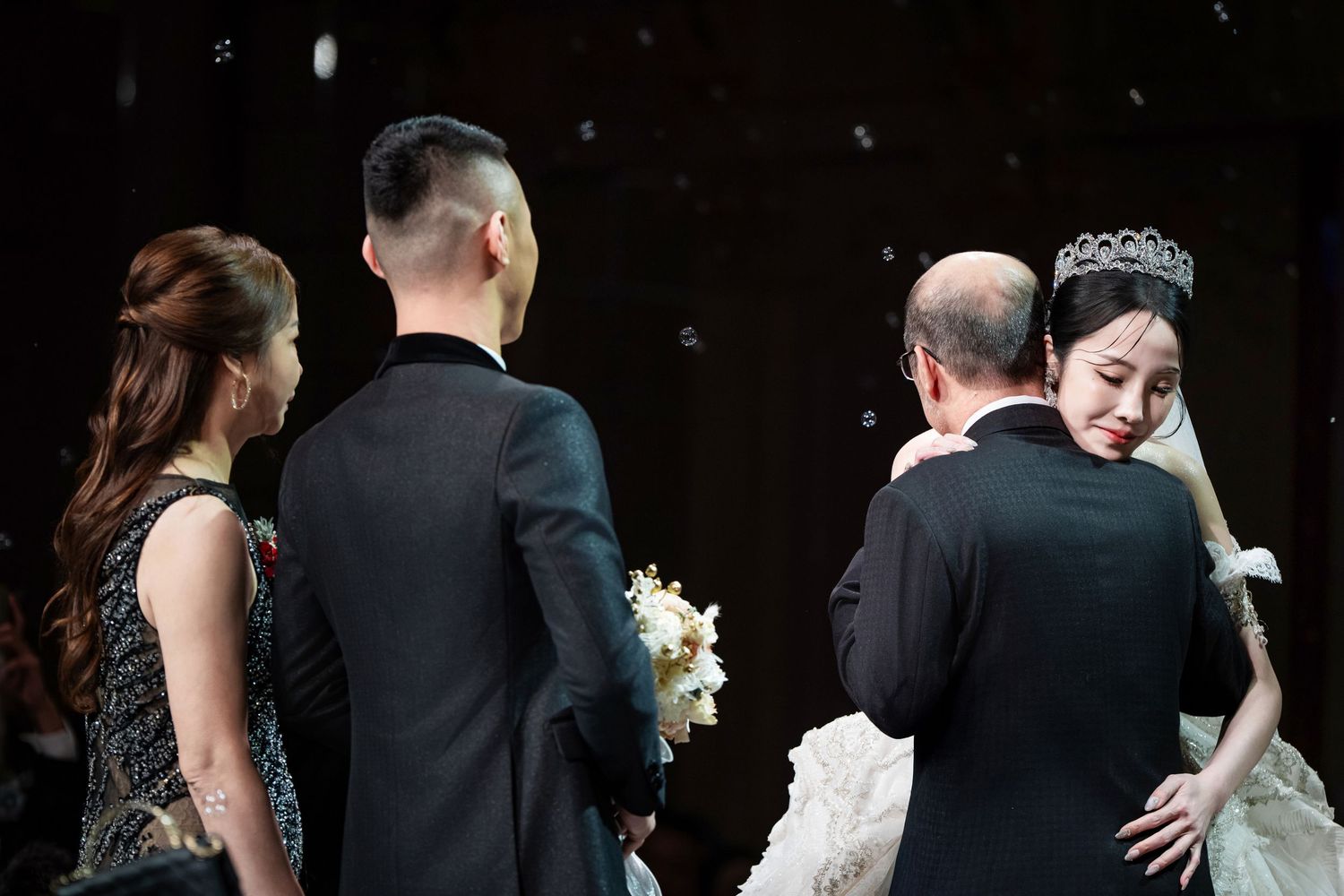 A series of wedding dance photos showing couples embracing and dancing together at a formal reception.