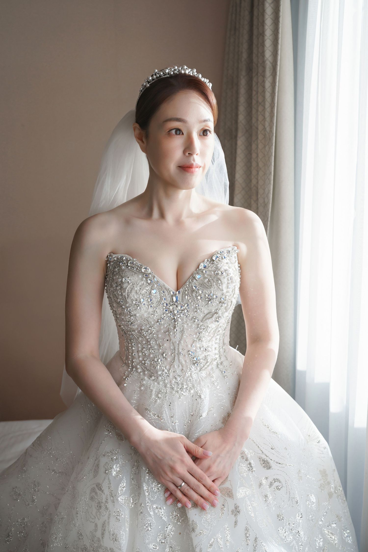 A close-up series of a wedding dress with intricate beaded bodice and sweetheart neckline against a light background.