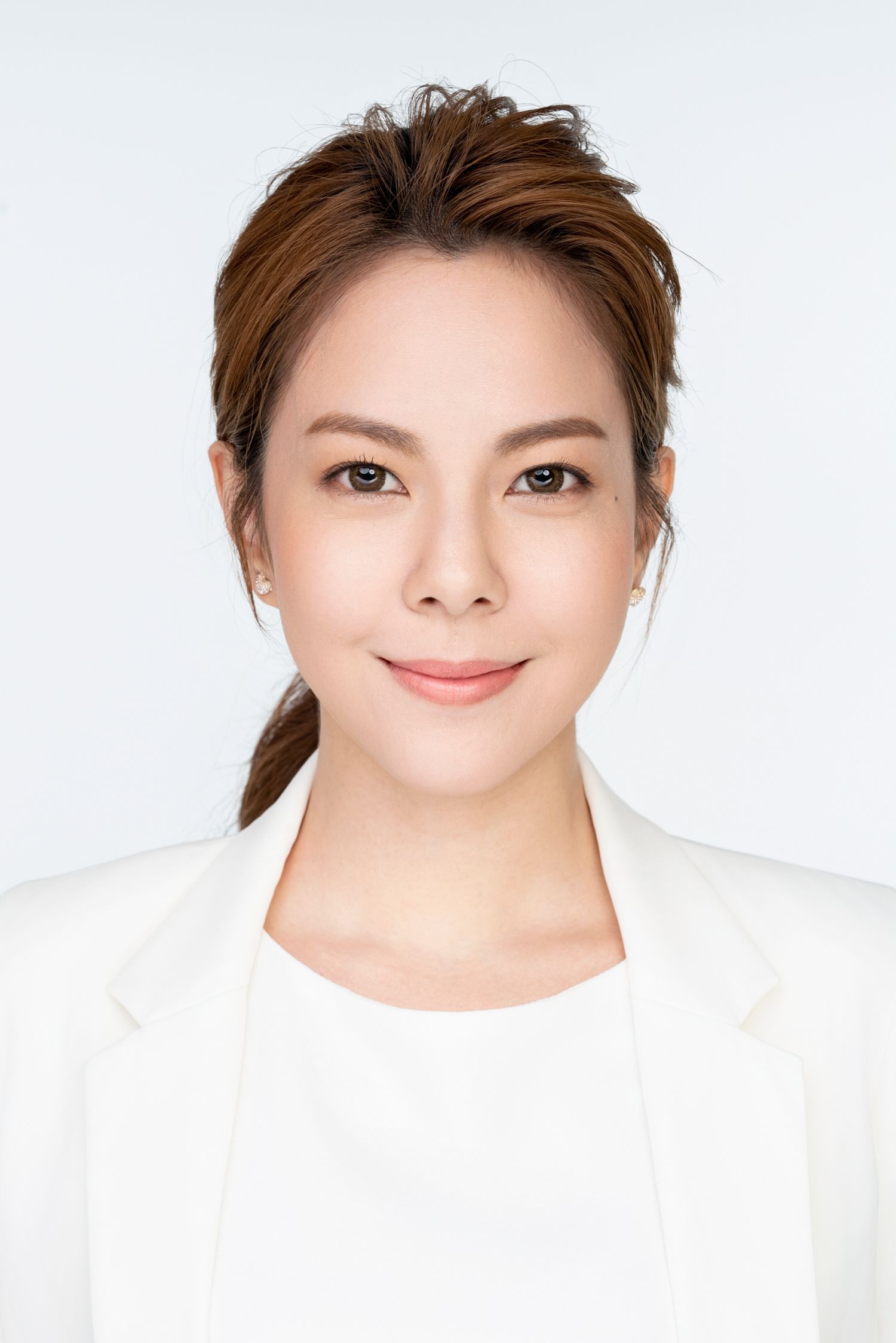 Person wearing a white top poses with different facial expressions in a series of headshots against a light background.