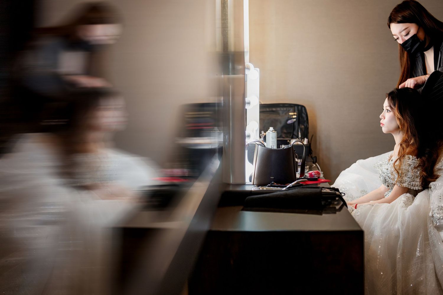 A series of blurred motion shots showing movement across a dark interior space.